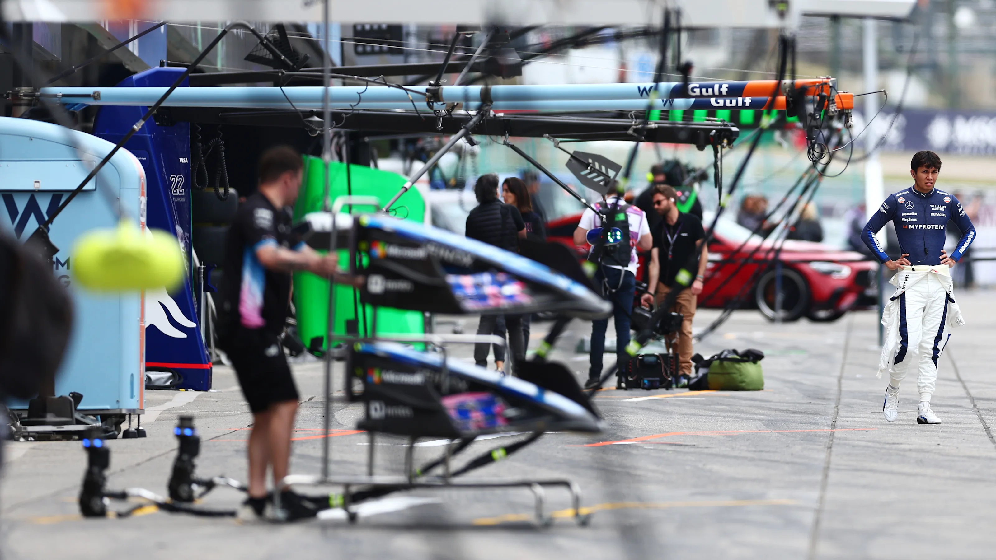 SUZUKA, JAPAN - APRIL 05: Alexander Albon of Thailand and Williams looks on in the Pitlane during