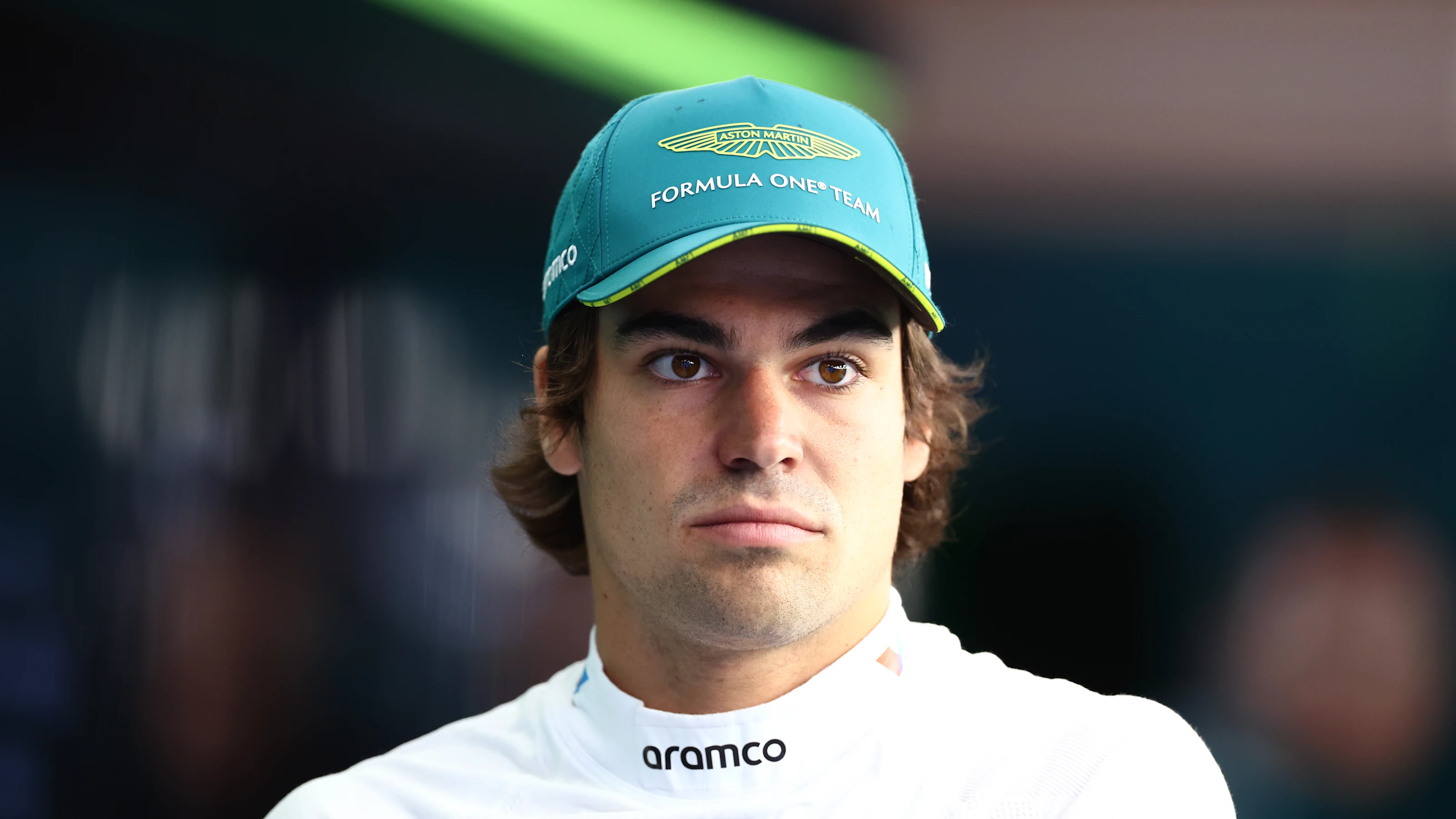 SUZUKA, JAPAN - APRIL 05: Lance Stroll of Canada and Aston Martin F1 Team looks on in the garage