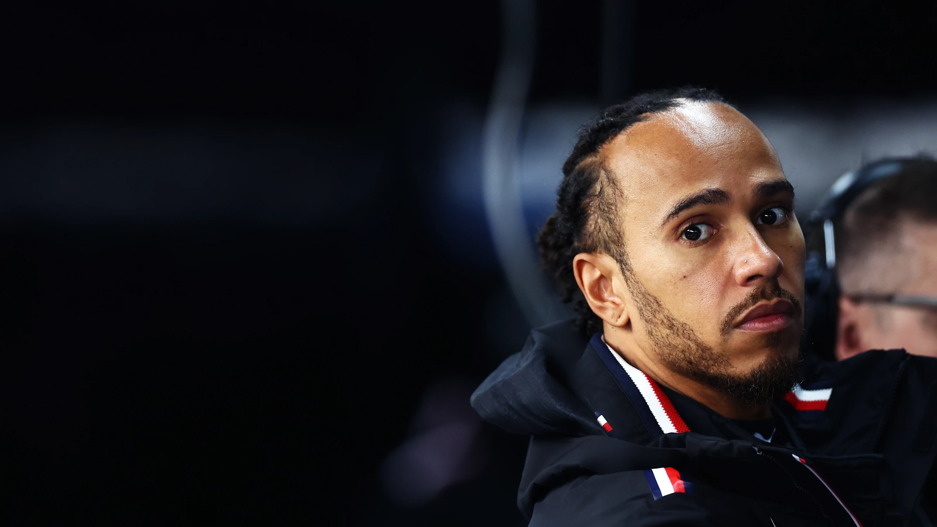 SUZUKA, JAPAN - APRIL 05: Lewis Hamilton of Great Britain and Mercedes looks on in the garage