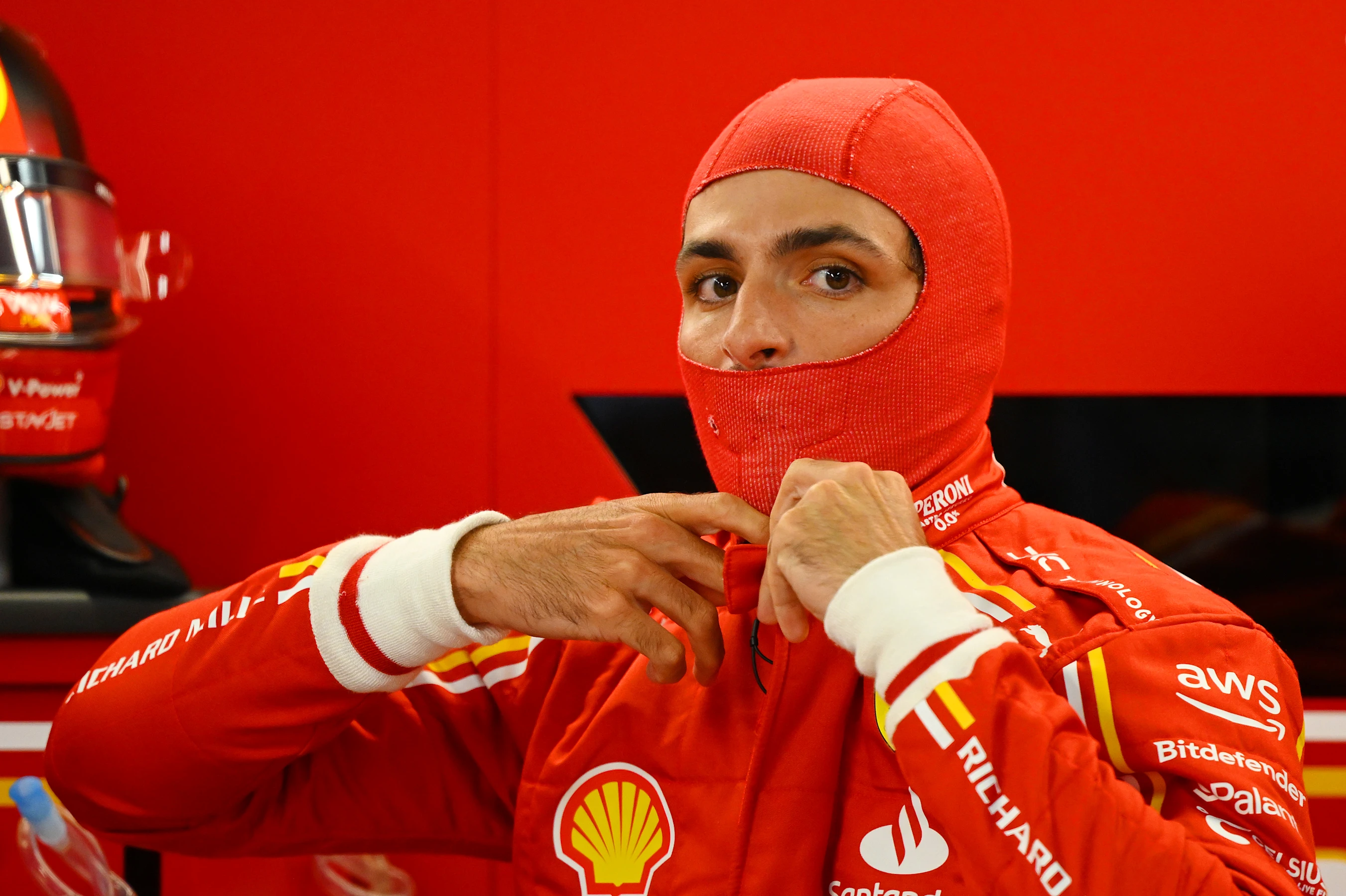 SUZUKA, JAPAN - APRIL 05: Carlos Sainz of Spain and Ferrari prepares to drive in the garage during