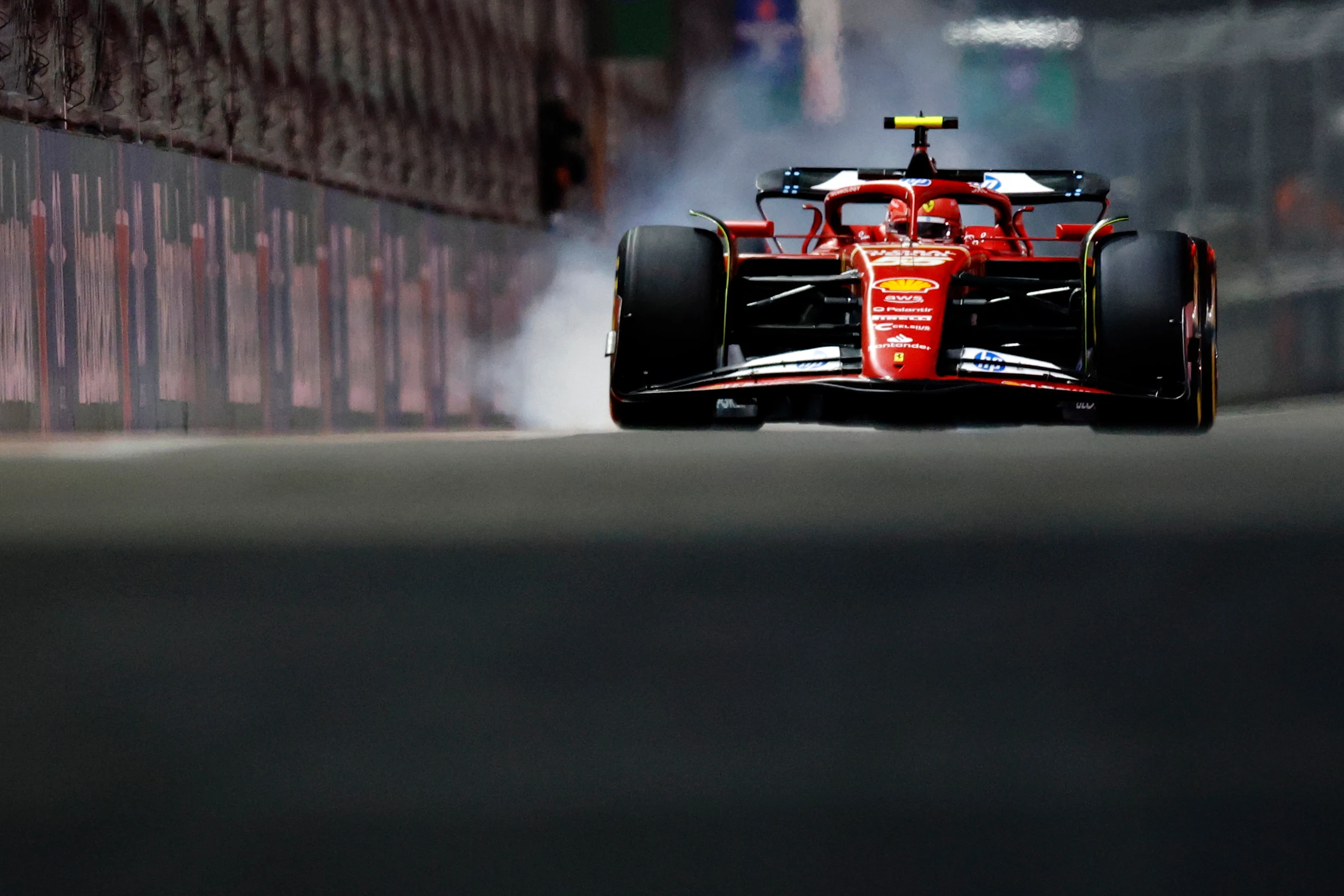 LAS VEGAS, NEVADA - NOVEMBER 21: Carlos Sainz of Spain driving (55) the Ferrari SF-24 locks a wheel