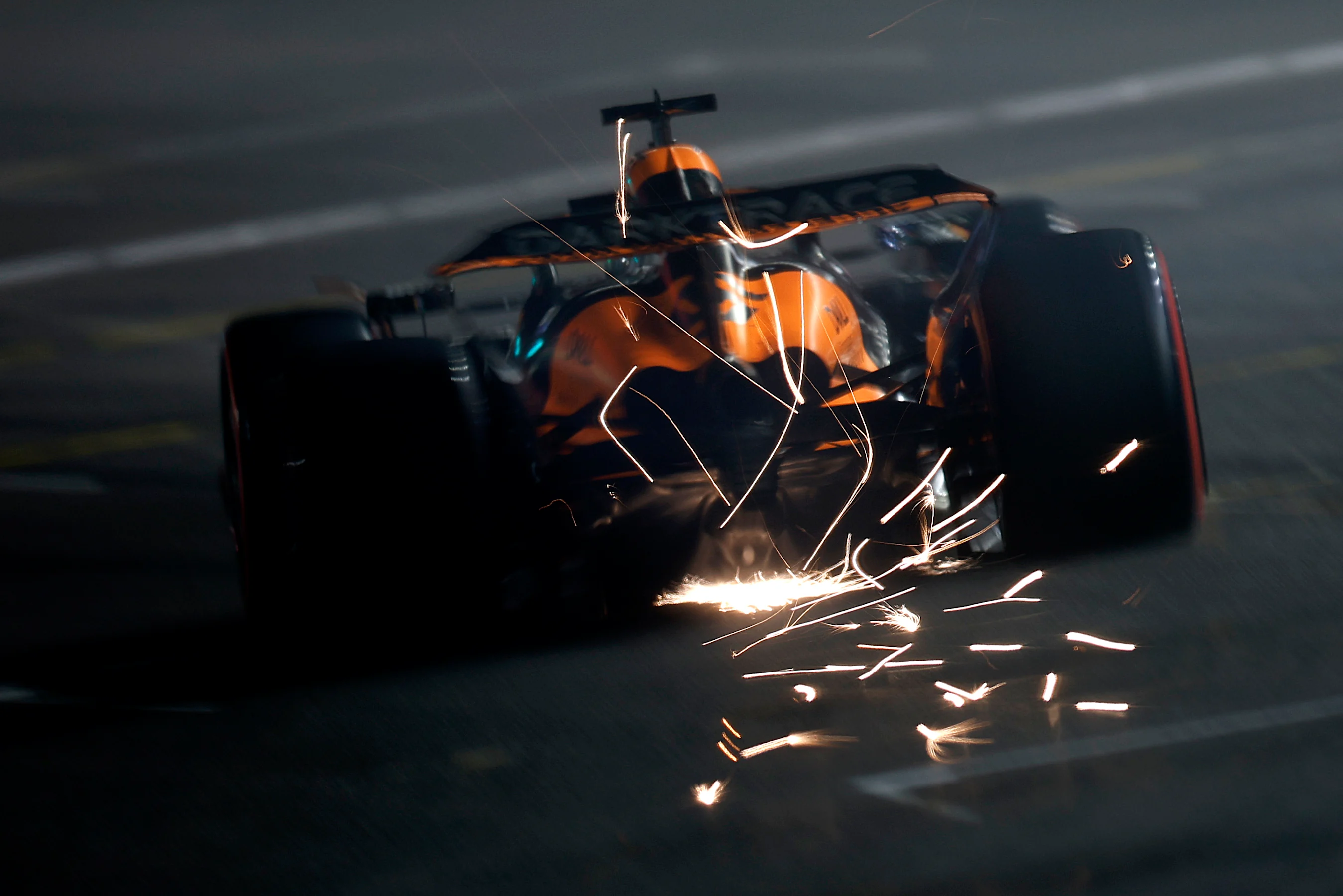 LAS VEGAS, NEVADA - NOVEMBER 22: Sparks fly behind Oscar Piastri of Australia driving the (81)