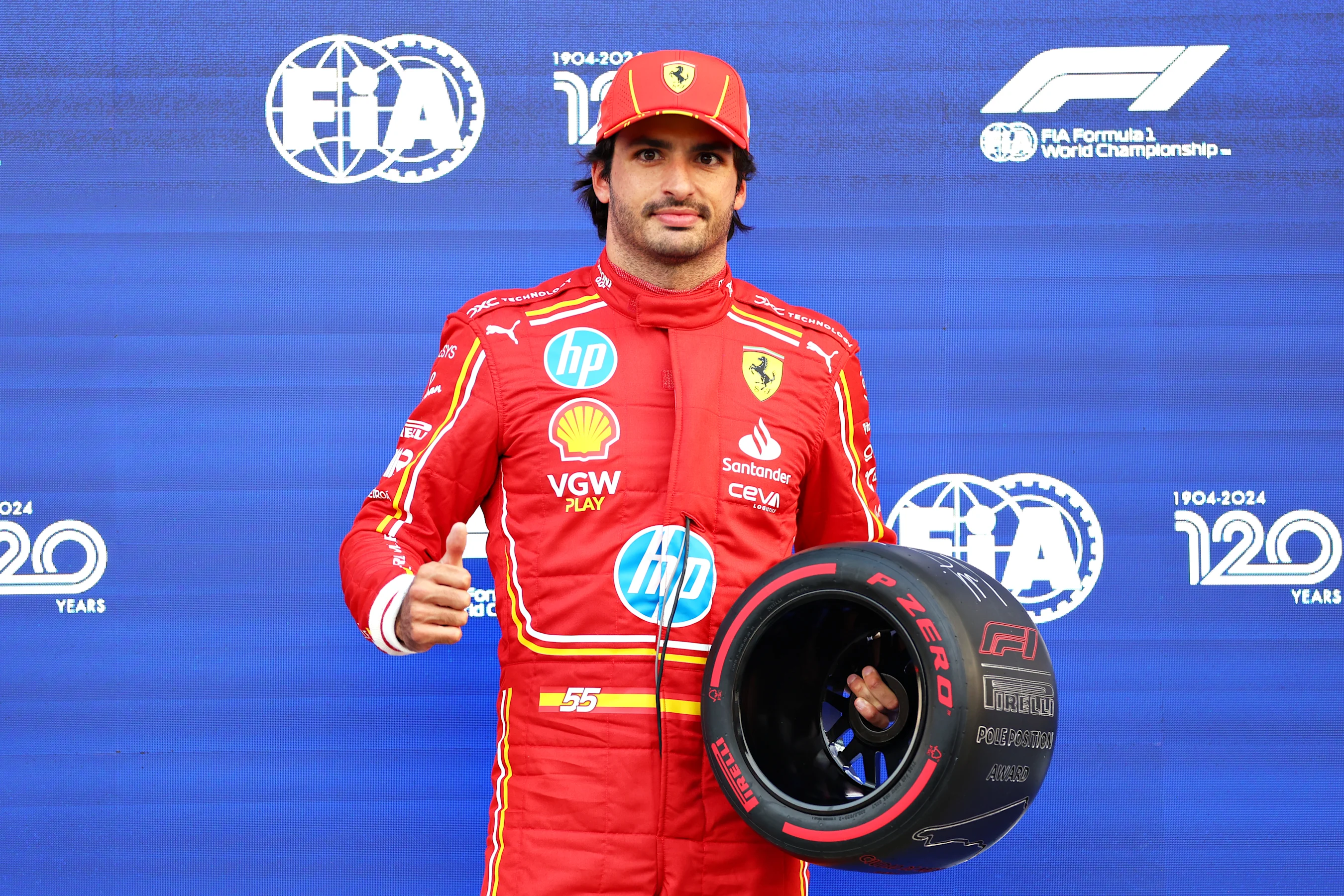 MEXICO CITY, MEXICO - OCTOBER 26: Pole position qualifier Carlos Sainz of Spain and Ferrari poses