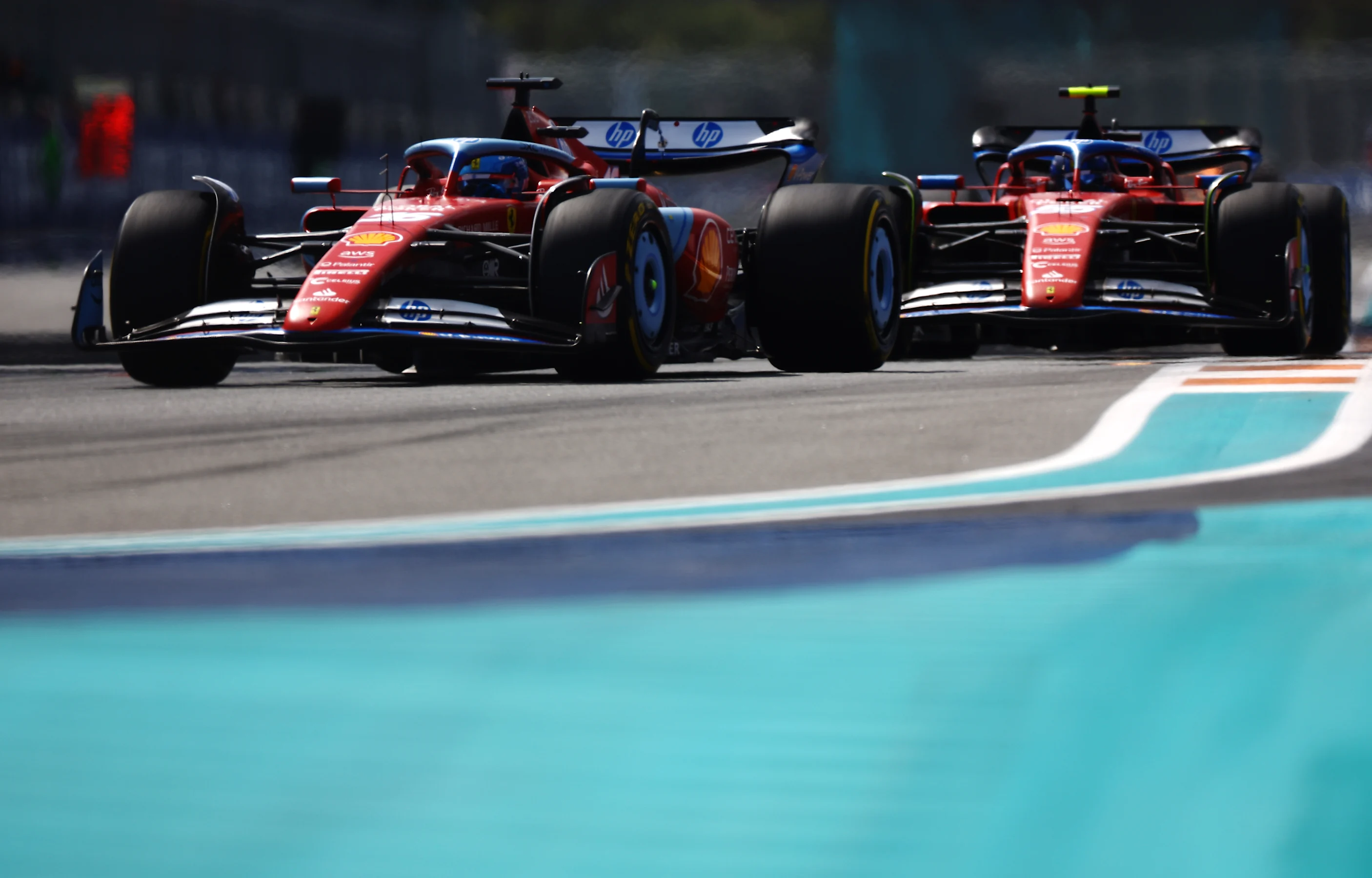 MIAMI, FLORIDA - MAY 05: Carlos Sainz of Spain driving (55) the Ferrari SF-24 leads Charles Leclerc