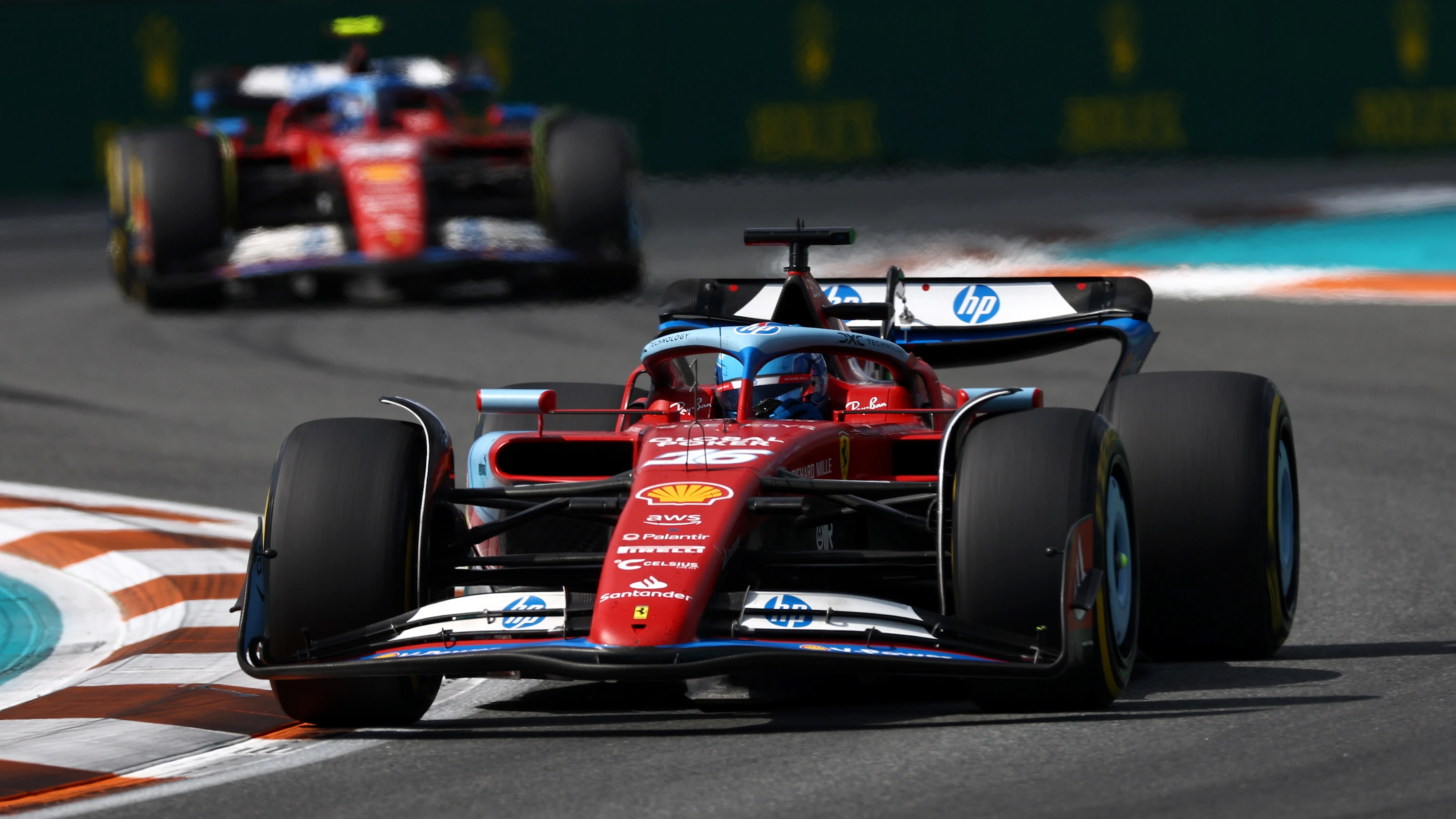 MIAMI, FLORIDA - MAY 05: Charles Leclerc of Monaco driving the (16) Ferrari SF-24 leads Carlos