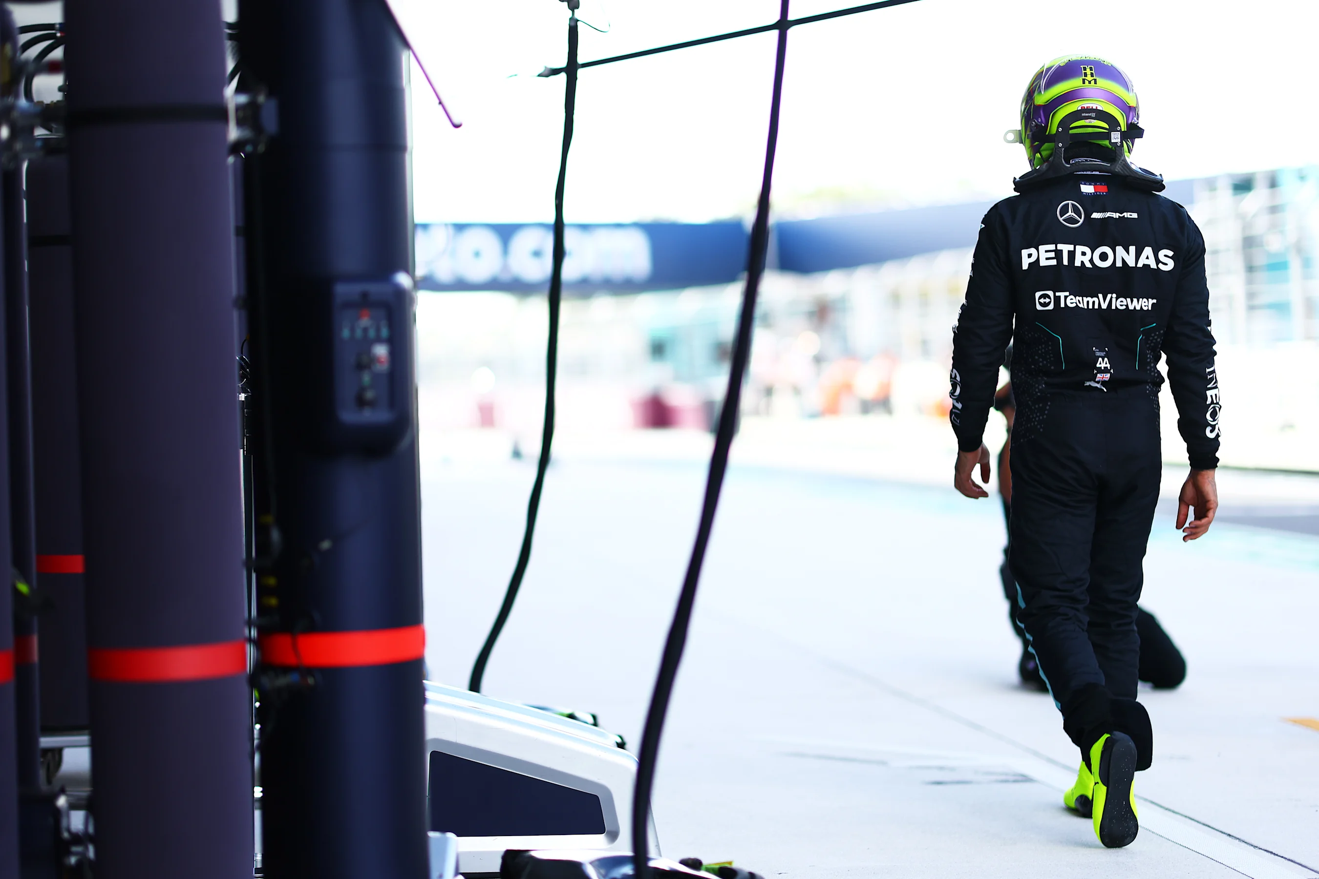 MIAMI, FLORIDA - MAY 03: 12th placed qualifier Lewis Hamilton of Great Britain and Mercedes walks