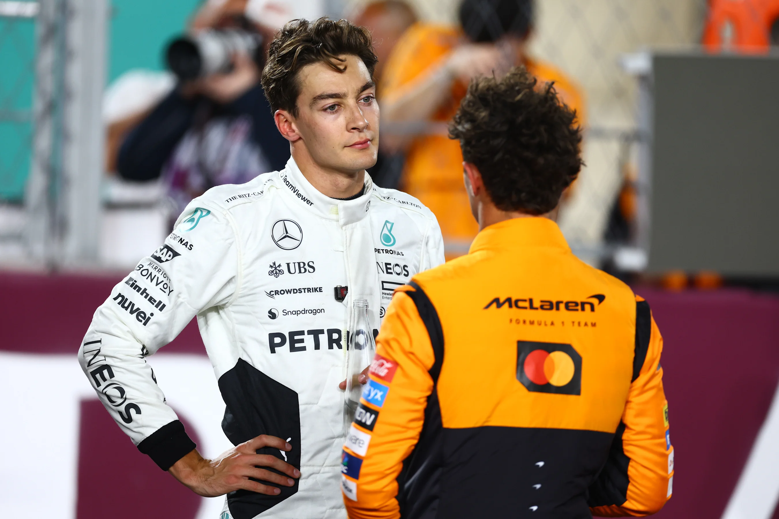 LUSAIL CITY, QATAR - NOVEMBER 30: Second placed Lando Norris of Great Britain and McLaren and Third
