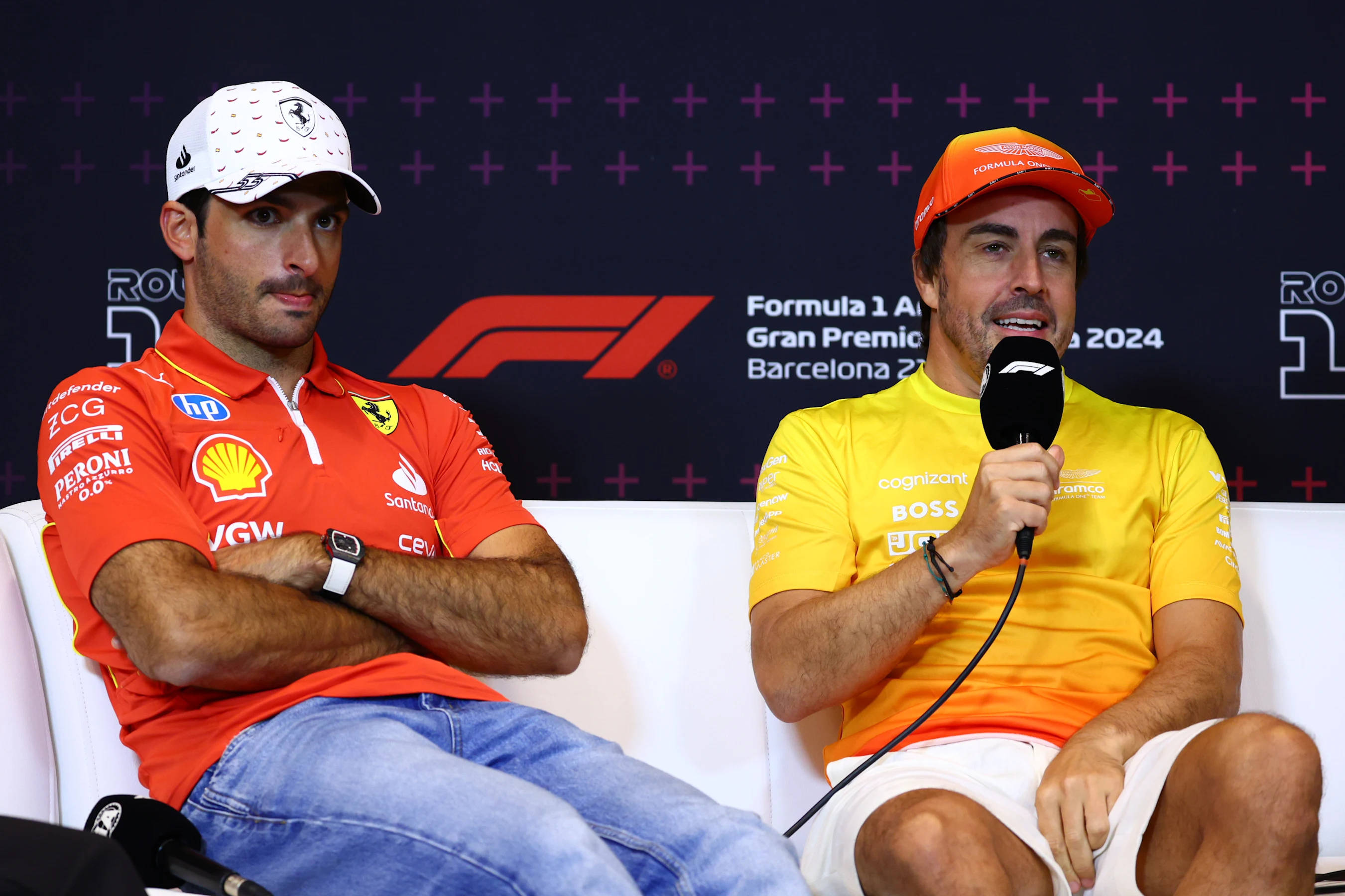 BARCELONA, SPAIN - JUNE 20: Carlos Sainz of Spain and Ferrari and Fernando Alonso of Spain and