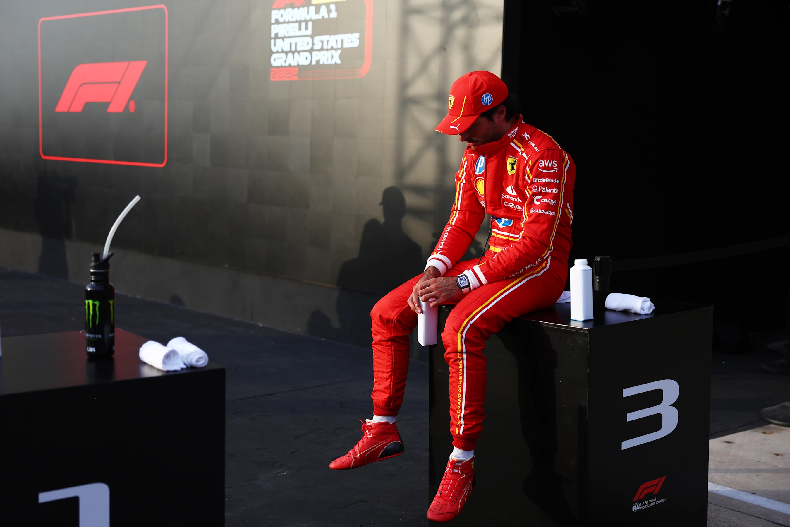 AUSTIN, TEXAS - OCTOBER 19: Third placed qualifier Carlos Sainz of Spain and Ferrari looks on in