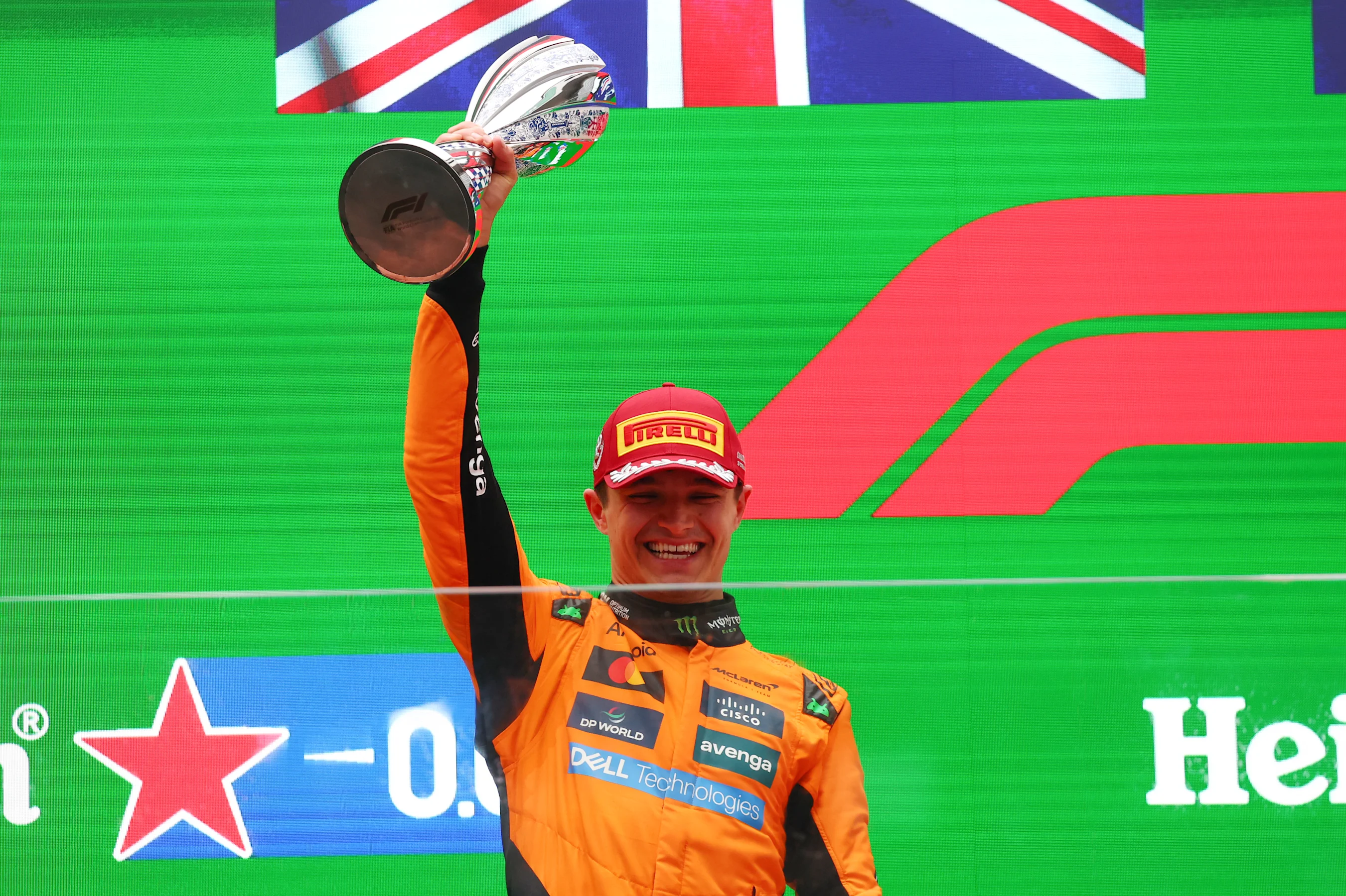 SHANGHAI, CHINA - MARCH 23: Second placed Lando Norris of Great Britain and McLaren lifts his