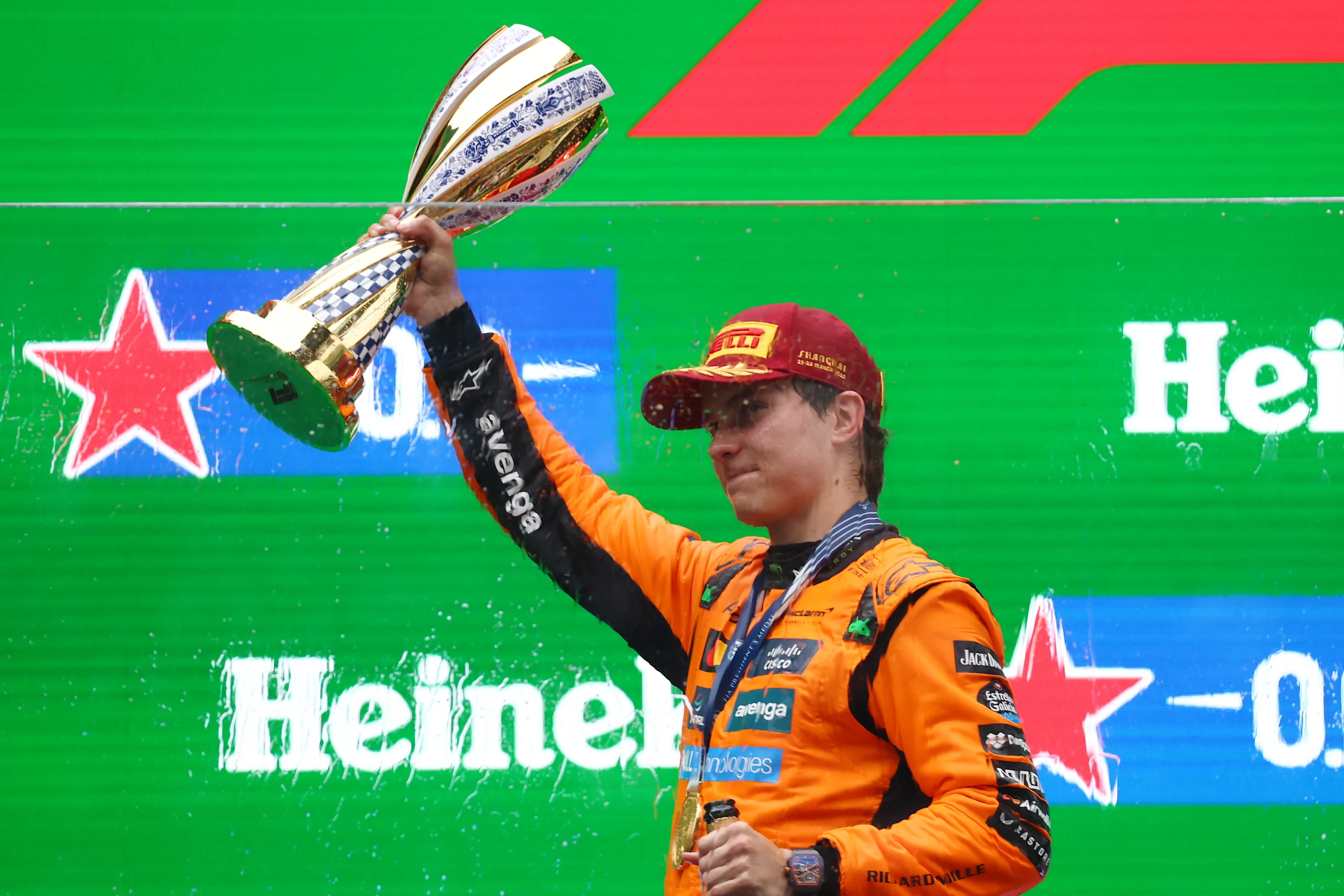 SHANGHAI, CHINA - MARCH 23: Race winner Oscar Piastri of Australia and McLaren lifts his trophy on