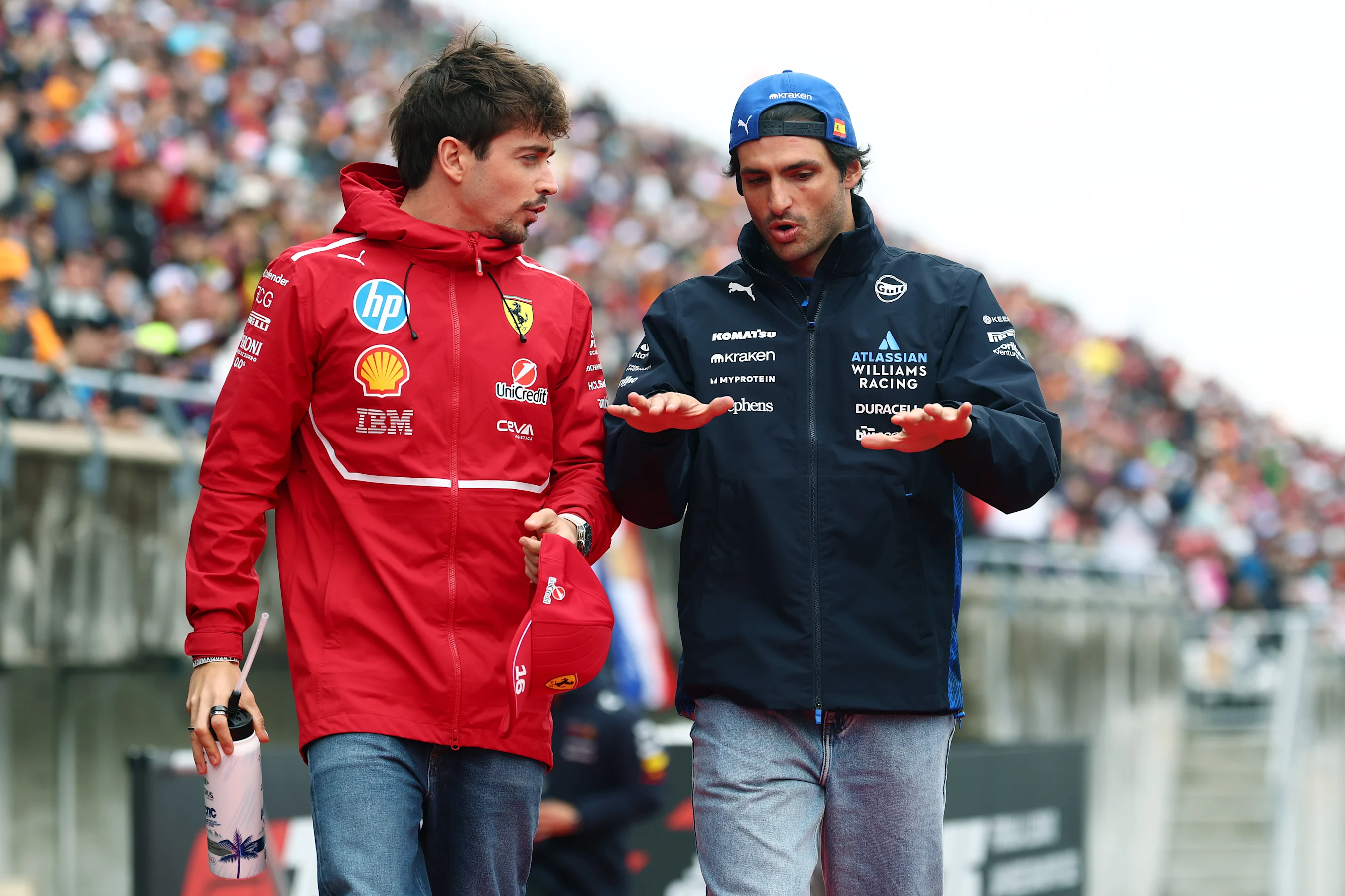 SUZUKA, JAPAN - APRIL 06: Charles Leclerc of Monaco and Scuderia Ferrari and Carlos Sainz of Spain