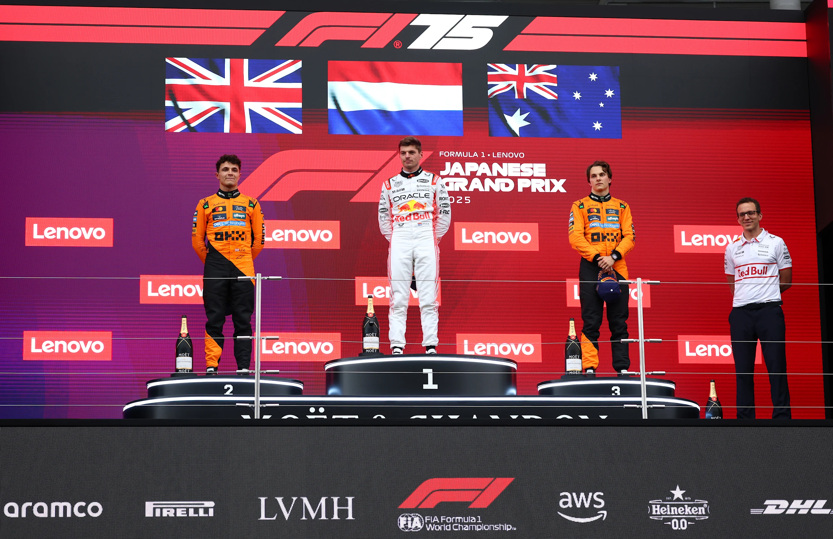 SUZUKA, JAPAN - APRIL 06: Second placed Lando Norris of Great Britain and McLaren Race winner Max