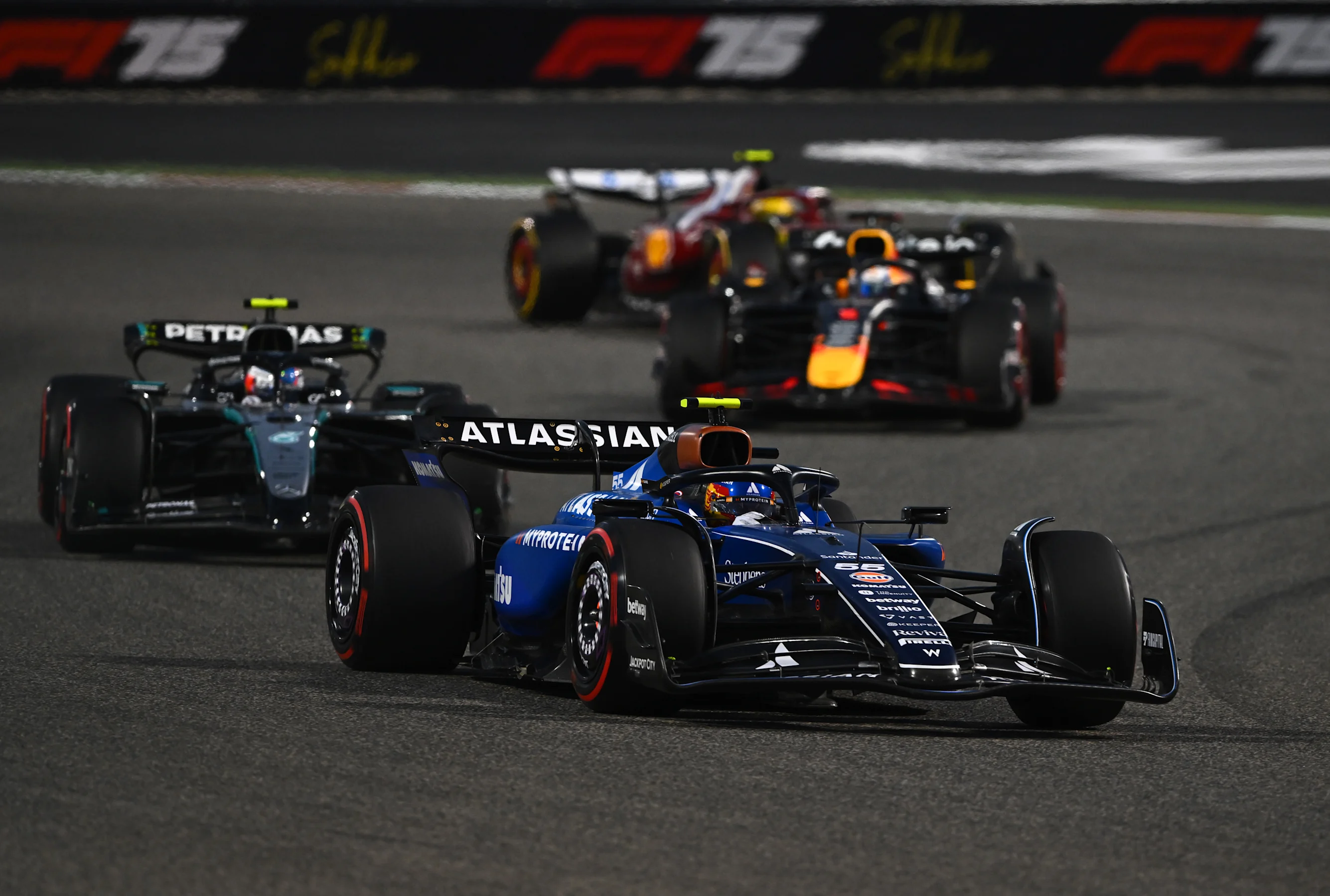 BAHRAIN, BAHRAIN - APRIL 13: Carlos Sainz of Spain driving the (55) Williams FW47 Mercedes leads