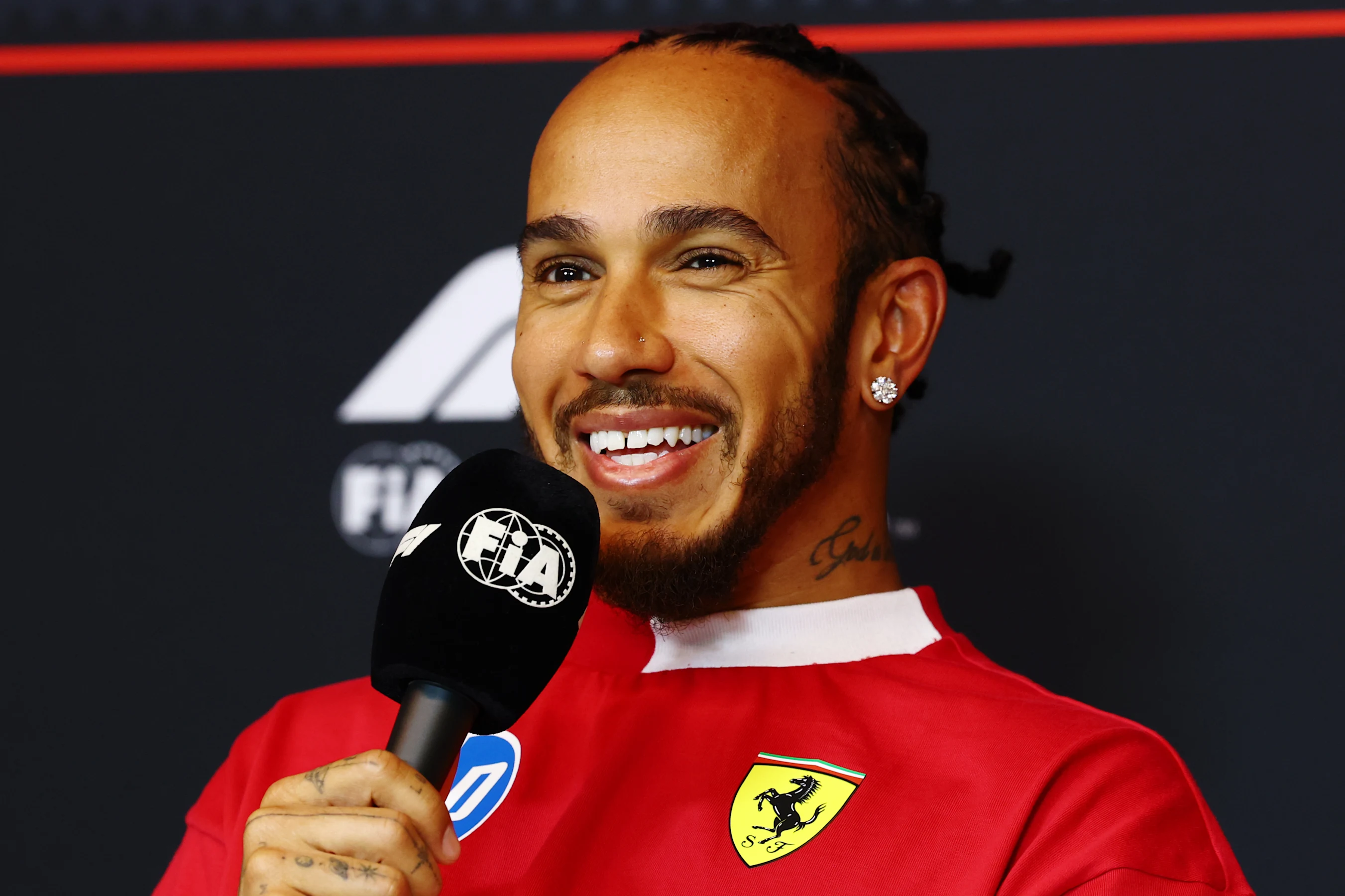 MONTREAL, QUEBEC - JUNE 12: Lewis Hamilton of Great Britain and Scuderia Ferrari speaks in the