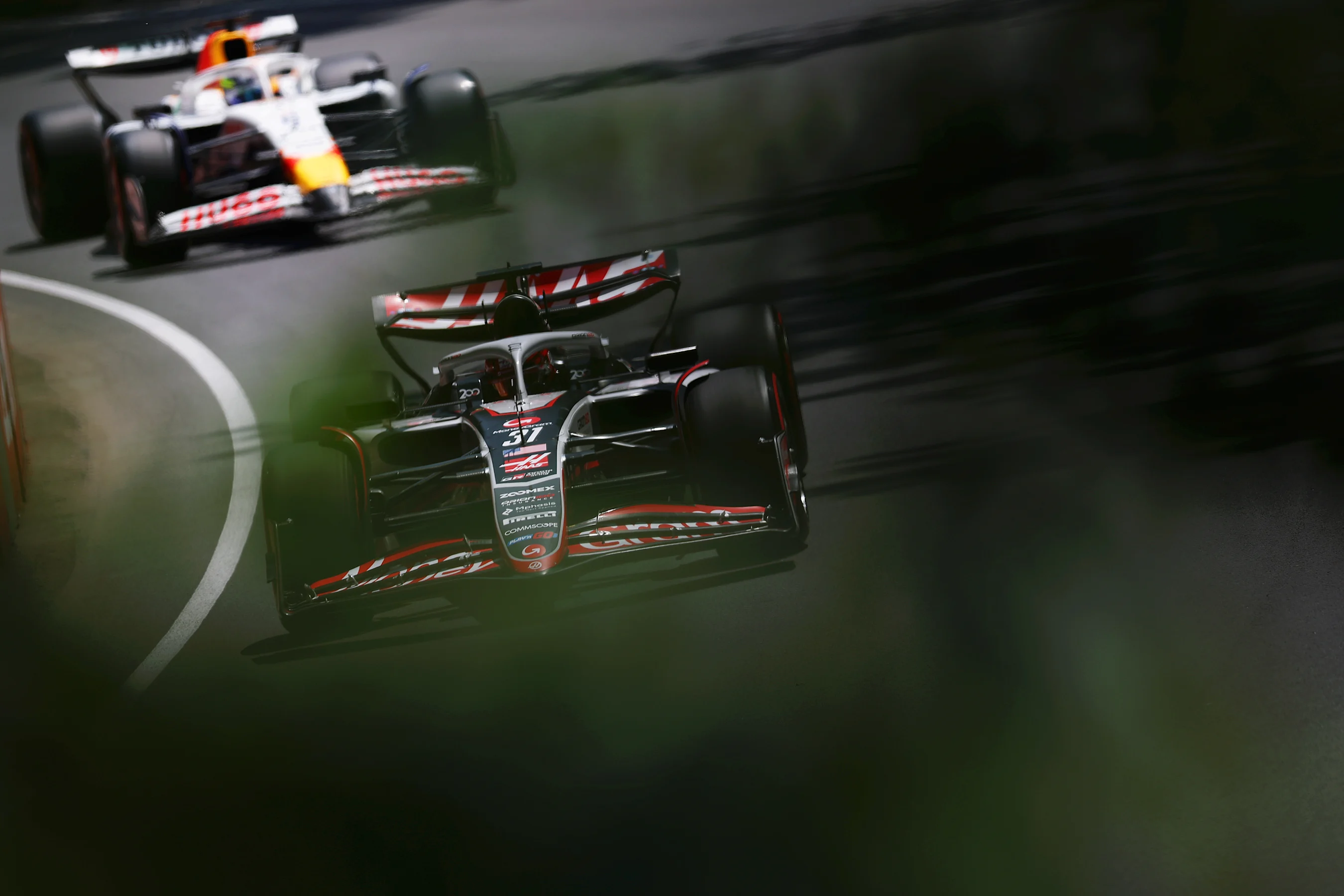 MONTREAL, QUEBEC - JUNE 14: Esteban Ocon of France driving the (31) Haas F1 VF-25 Ferrari leads