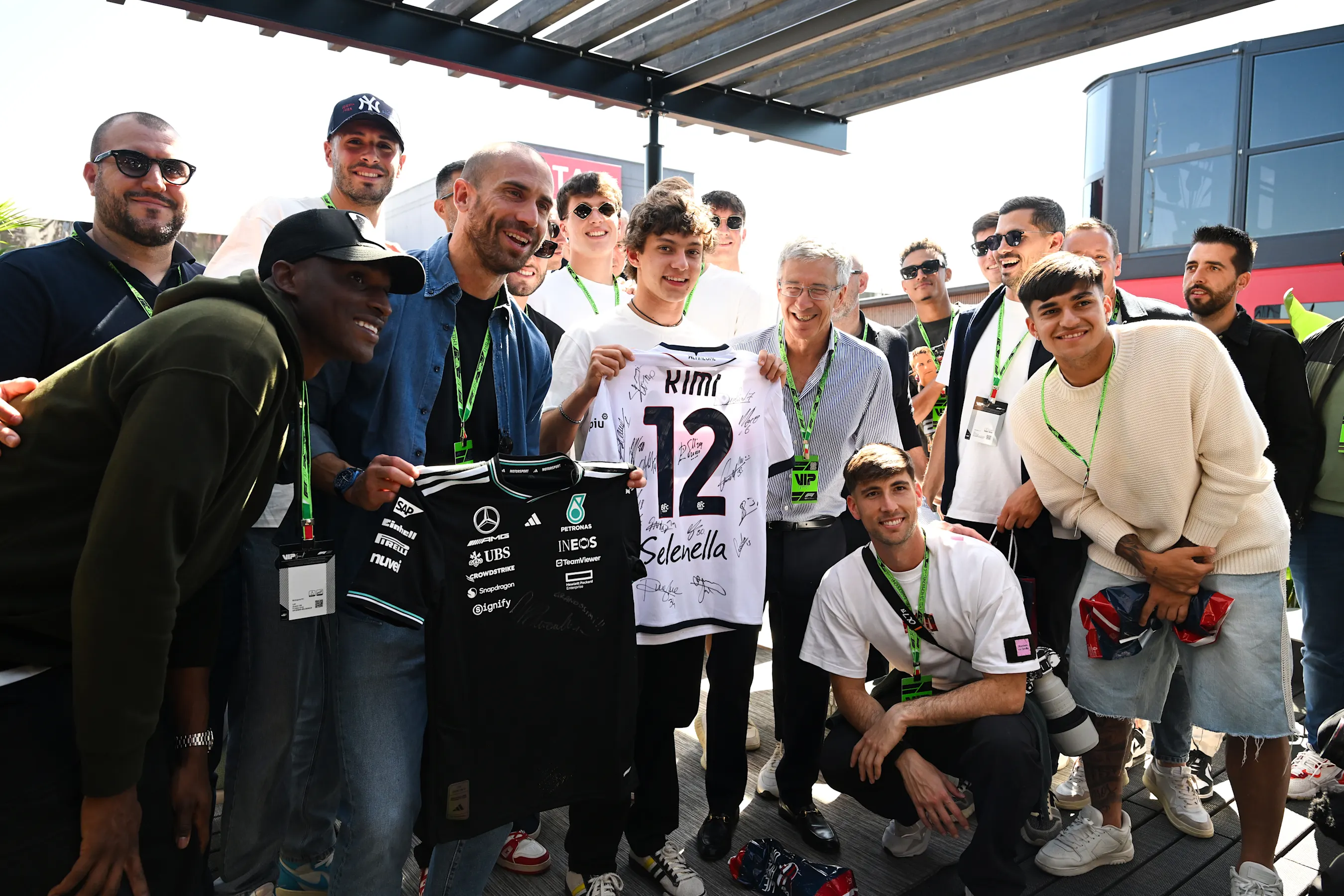 IMOLA, ITALY - MAY 16: Lorenzo De Silvestri of FC Bologna swaps shirts with Andrea Kimi Antonelli