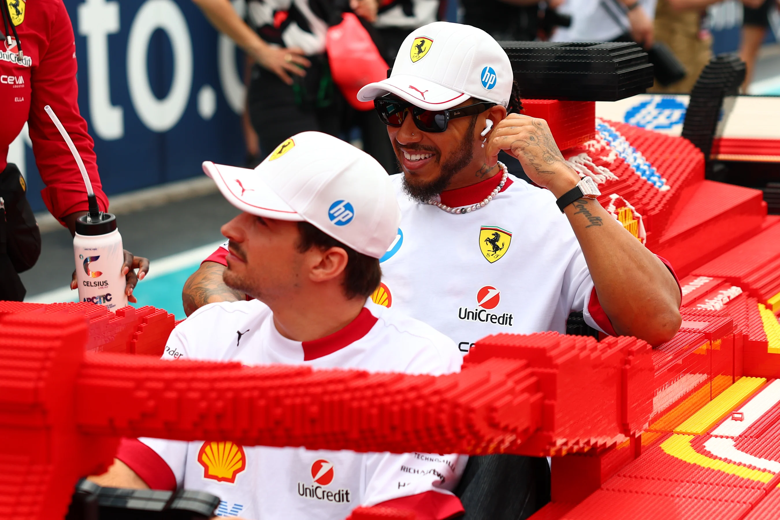 MIAMI, FLORIDA - MAY 04: Charles Leclerc of Monaco and Scuderia Ferrari and Lewis Hamilton of Great