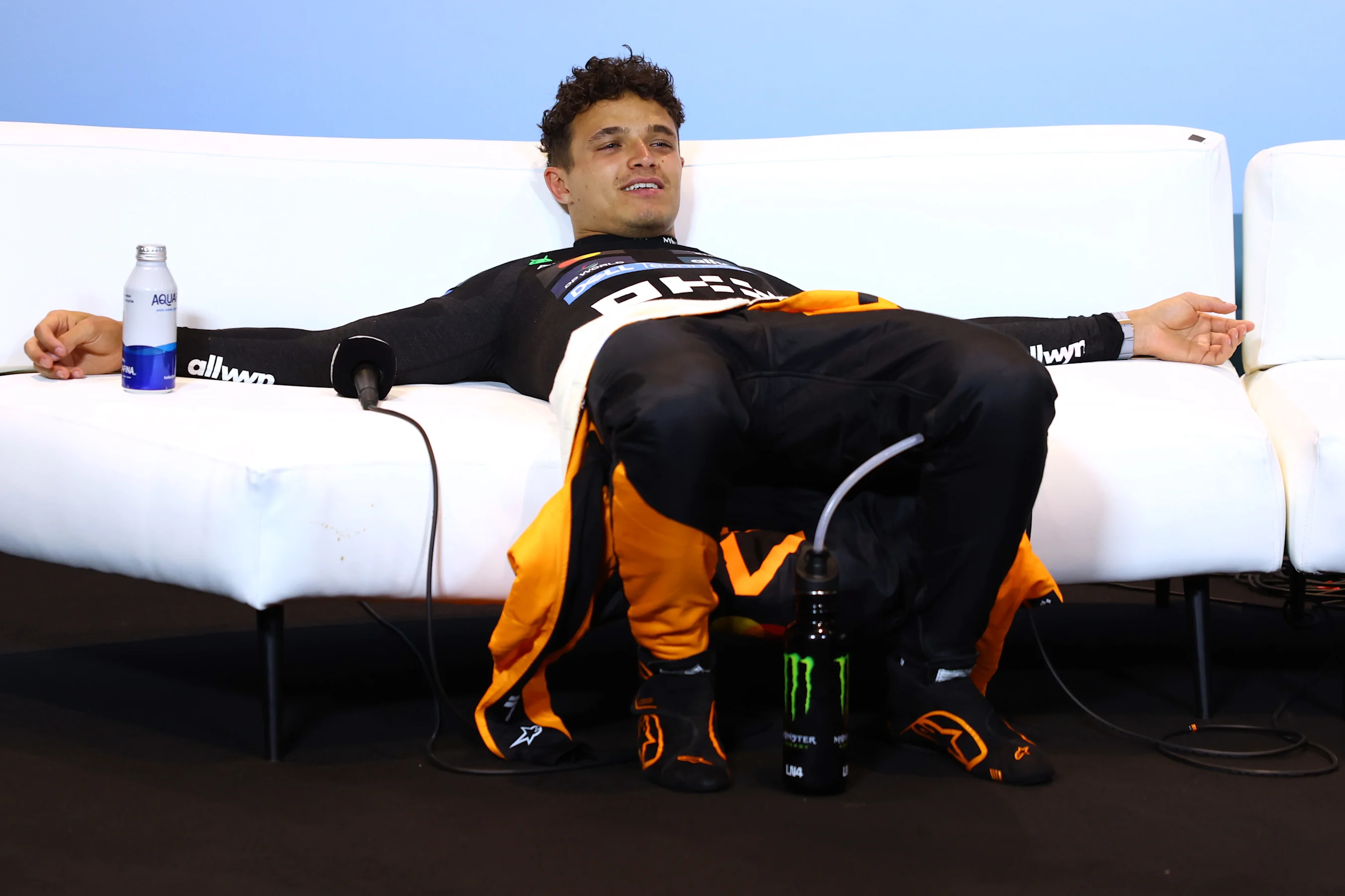 MIAMI, FLORIDA - MAY 04: Second placed Lando Norris of Great Britain and McLaren lays down in the