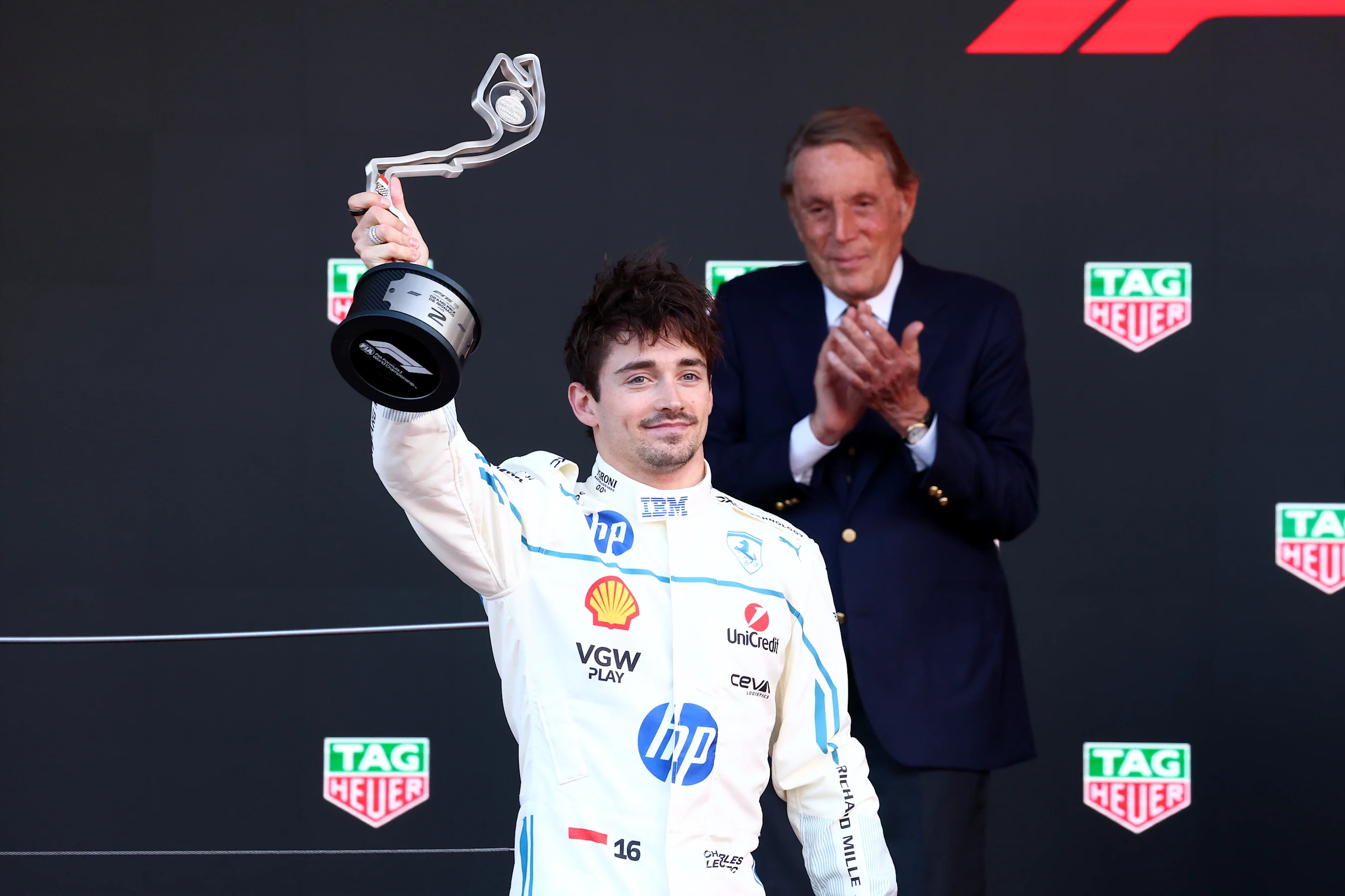 MONTE-CARLO, MONACO - MAY 25: Second placed Charles Leclerc of Monaco and Scuderia Ferrari lifts