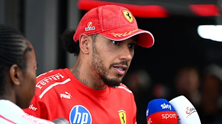 MONZA, ITALY - SEPTEMBER 03: Lewis Hamilton of Great Britain and Scuderia Ferrari looks on in the