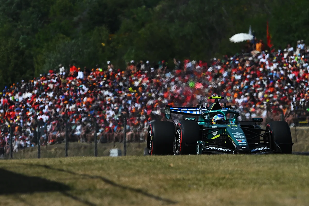 McLaren and Red Bull cars battle through Turn 1 at the 2026 Hungarian Grand Prix in Budapest