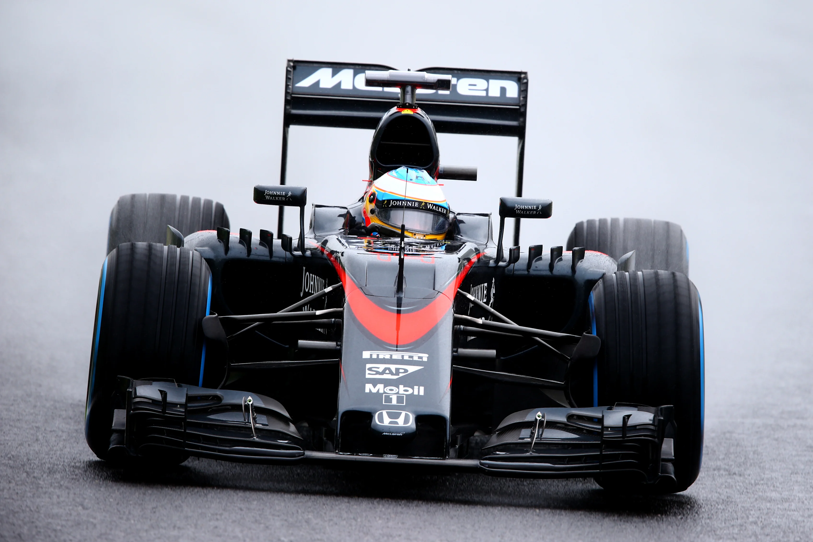 SUZUKA, JAPAN - SEPTEMBER 25: Fernando Alonso of Spain and McLaren Honda drives during practice