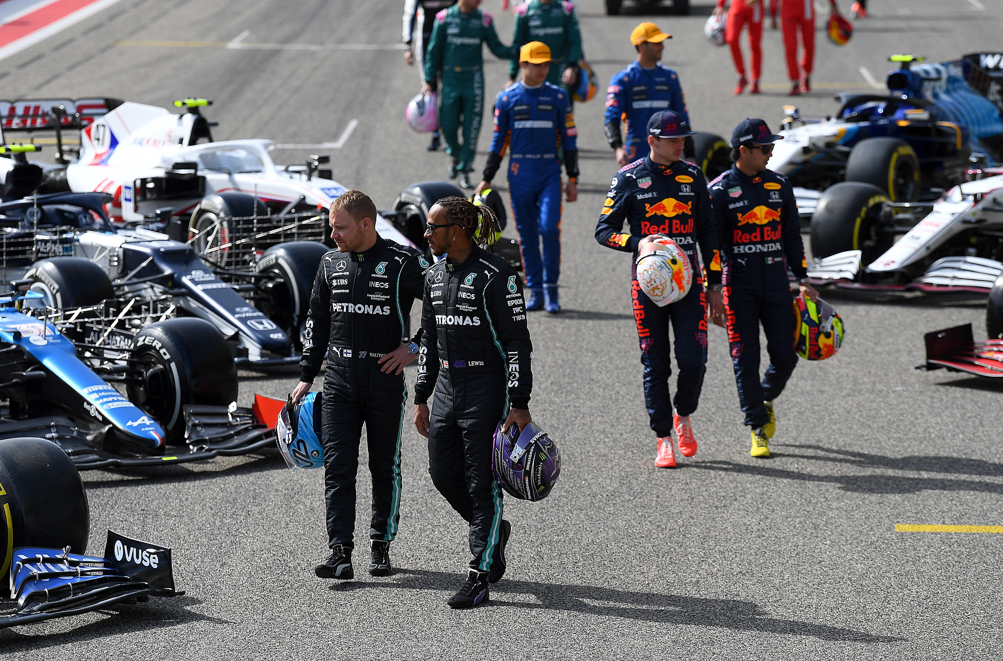BAHRAIN, BAHRAIN - MARCH 12: Lewis Hamilton and Valtteri Bottas of Mercedes pose on the grid during