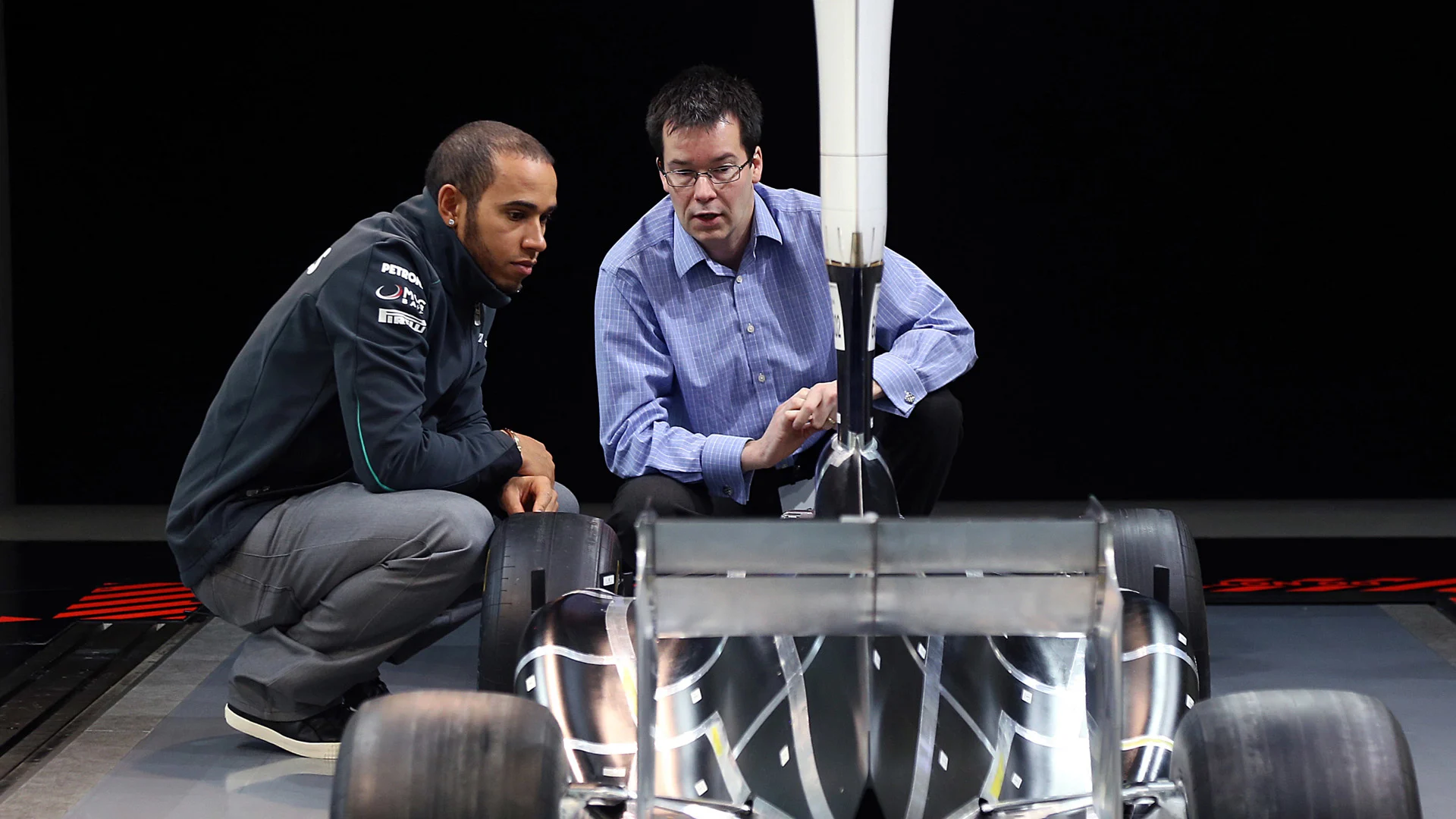 Lewis Hamilton and Mike Elliott at Lewis' first visit to Brackley in 2013.