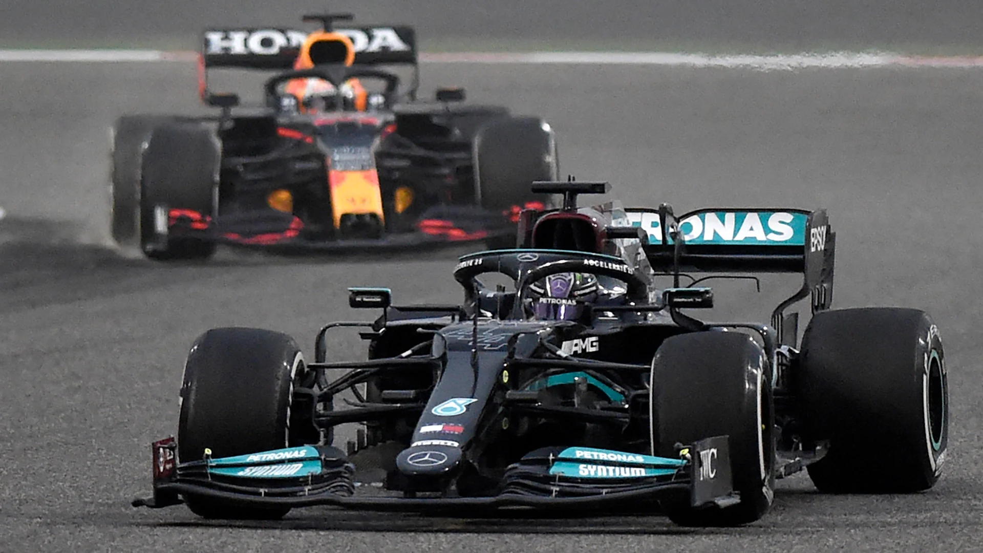Mercedes' British driver Lewis Hamilton leads Red Bull's Dutch driver Max Verstappen during the