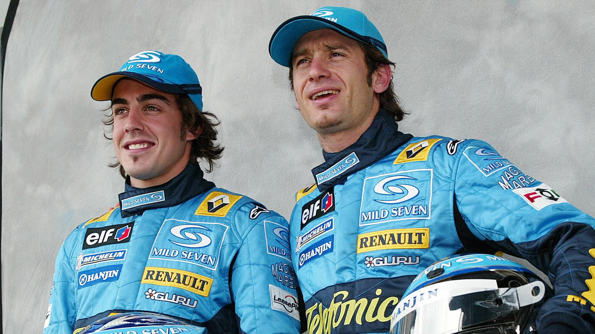 MELBOURNE, AUSTRALIA: Team Renault's Fernando Alonso (L) of Spain and Jarno Trulli (R) of Italy