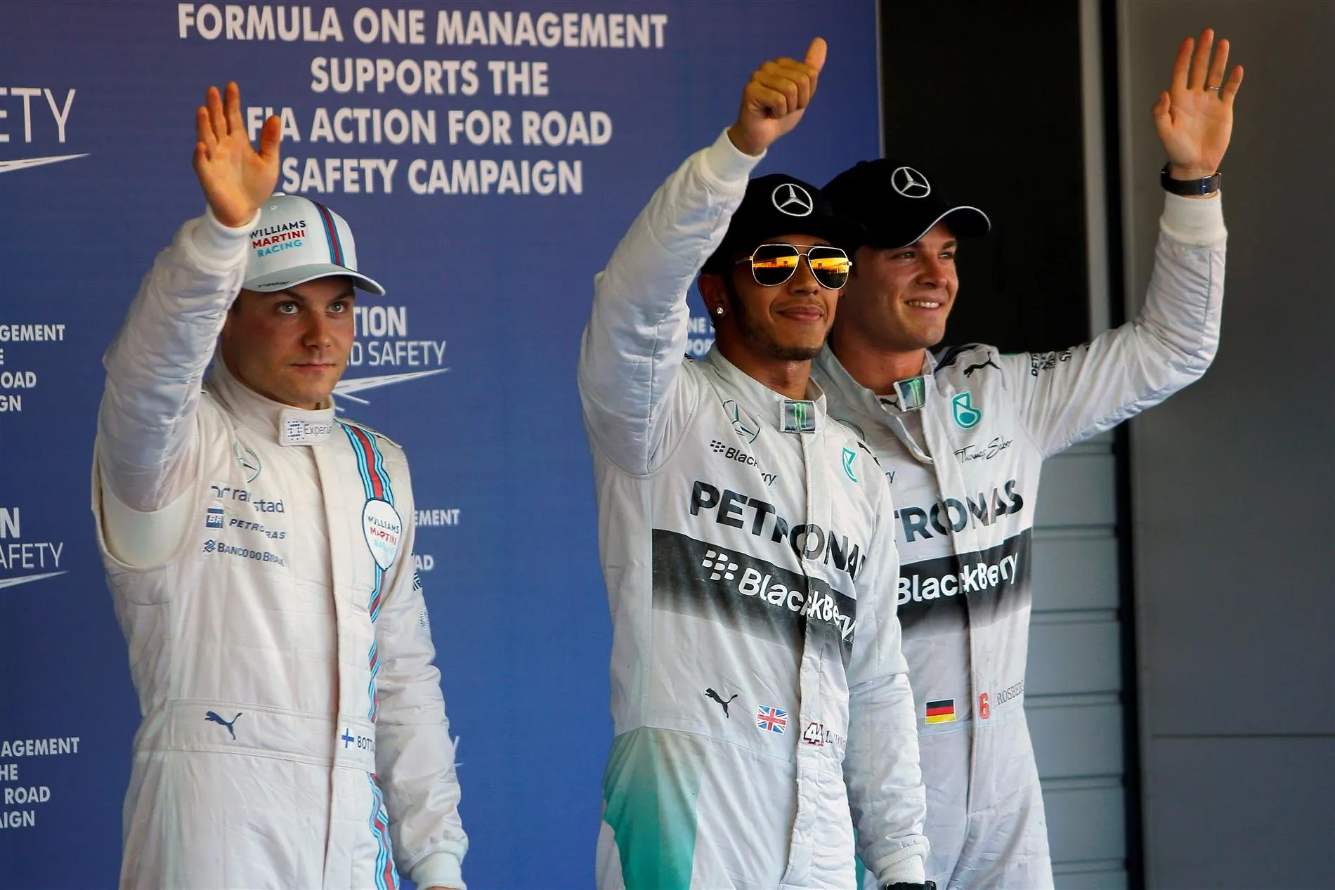 (L to R): Valtteri Bottas (FIN) Williams, pole sitter Lewis Hamilton (GBR) Mercedes AMG F1 and Nico Rosberg (GER) Mercedes AMG F1 celebrate in parc ferme. Formula One World Championship, Rd16, Russian Grand Prix, Qualifying, Sochi Autodrom, Sochi, Krasnodar Krai, Russia, Saturday, 11 October 2014 © Sutton Images. No reproduction without permission