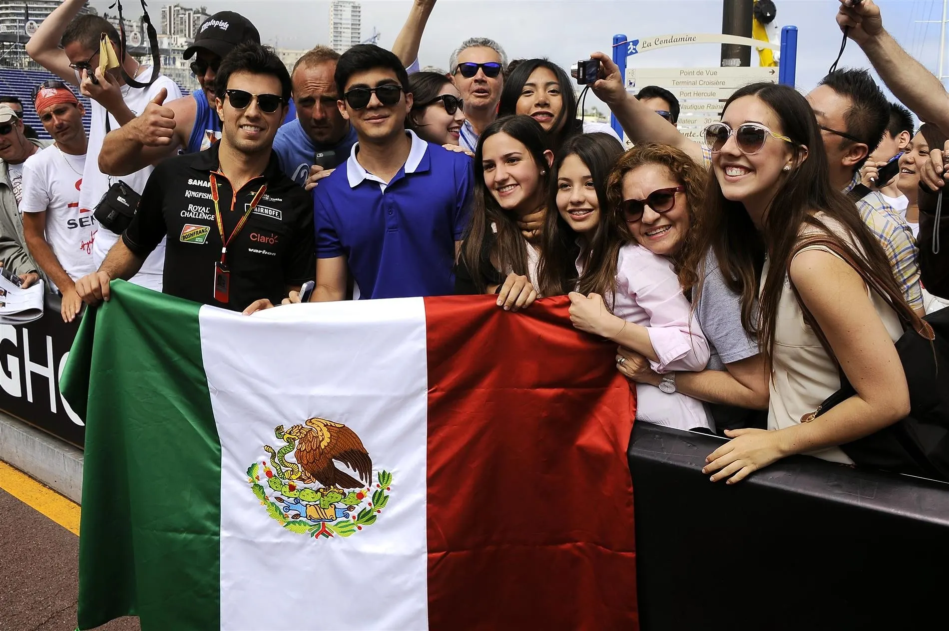 Sergio Perez (MEX) Force India F1 Team holds up a Mexican flag with fans. Formula One World Championship, Rd6, Monaco Grand Prix, Monte-Carlo, Monaco, Friday, 23 May 2014