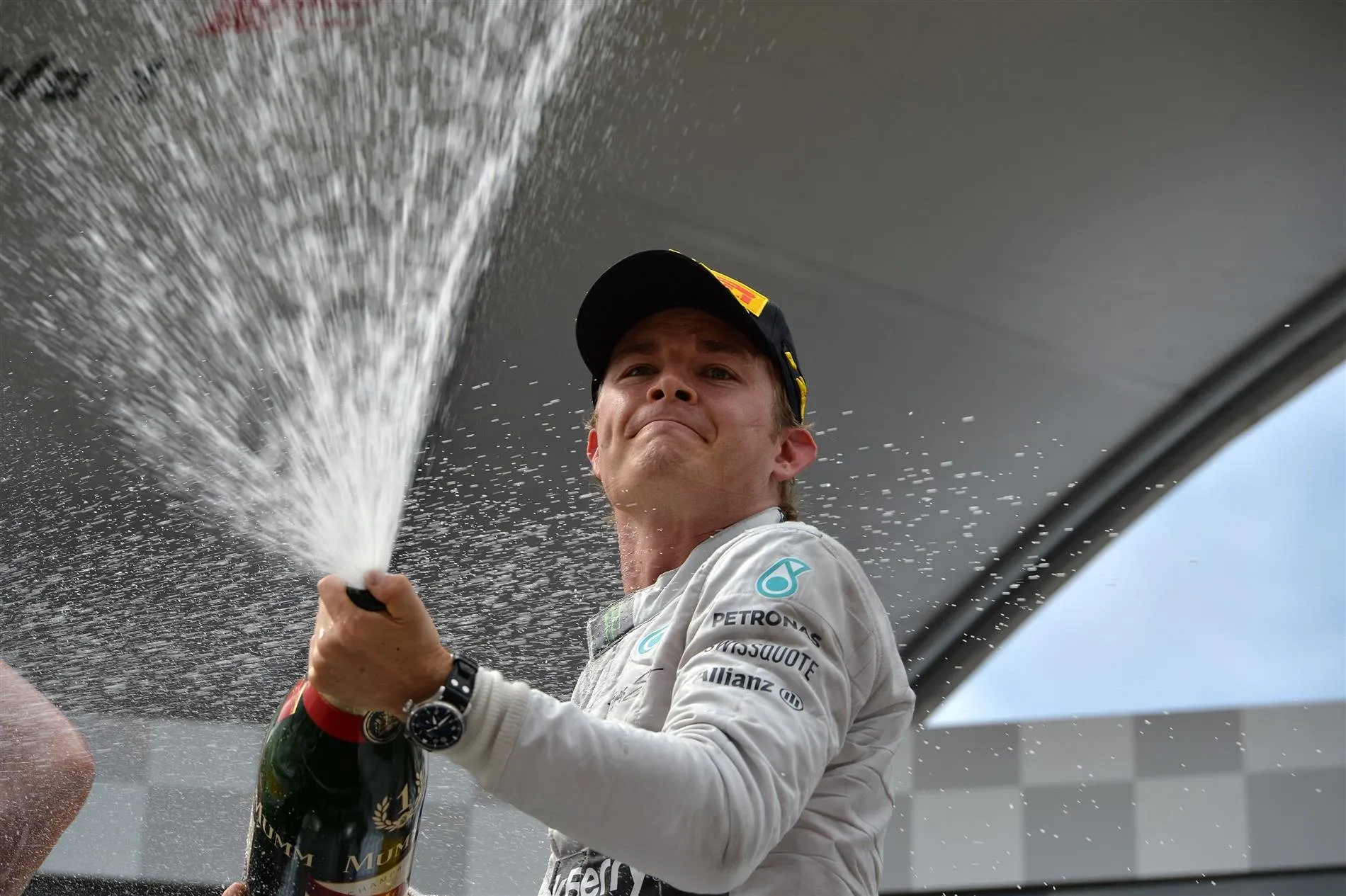 Race winner Nico Rosberg (GER) Mercedes AMG F1 celebrates with the champagne on the podium. Formula One World Championship, Rd8, Austrian Grand Prix, Race, Spielberg, Austria, Sunday, 22 June 2014