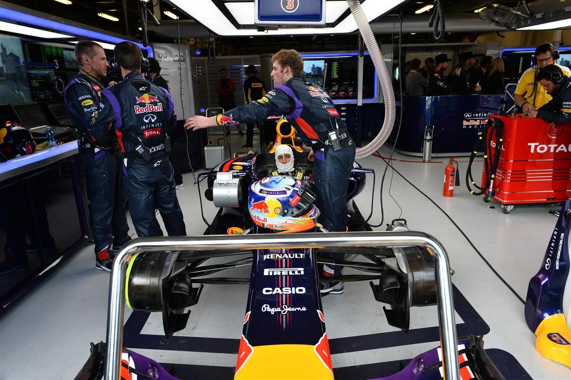 Daniel Ricciardo (AUS) Red Bull Racing RB10 in his pit garage. Formula One World Championship, Rd1, Australian Grand Prix, Race, Albert Park, Melbourne, Australia, Sunday, 16 March 2014