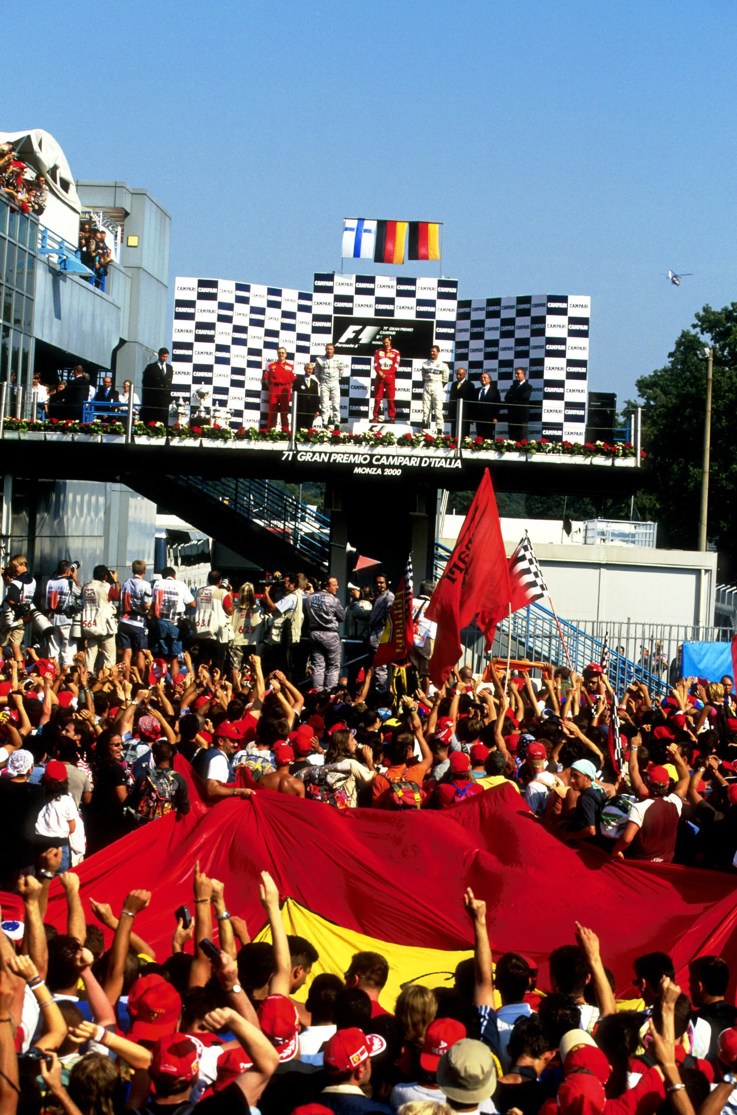 The Tifosi go crazy at Michael Schumacher(GER) Ferrari F1 2000 on the podium
Italian GP, Monza, 10 September 2000