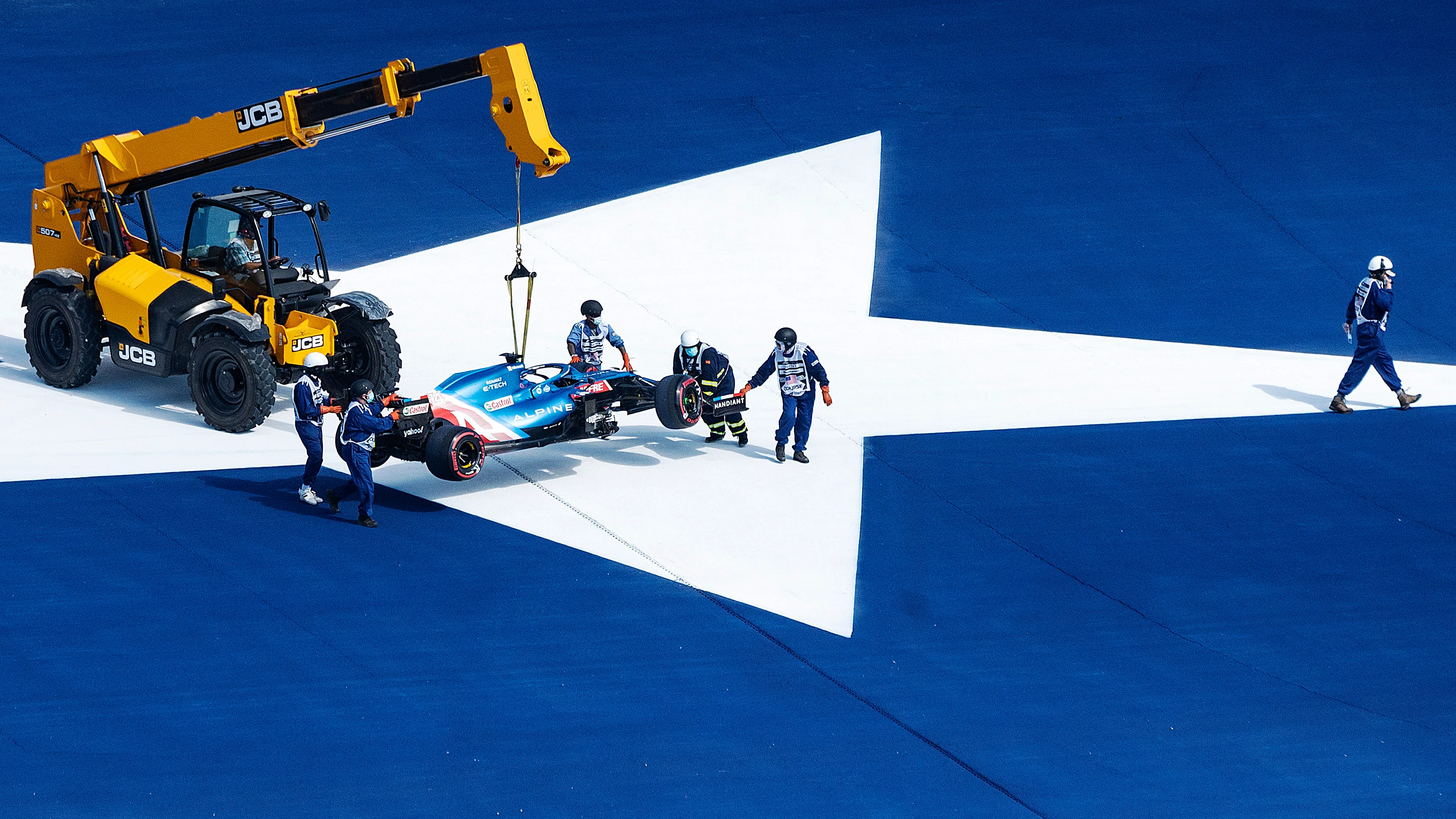 The car of Alpine's Spanish driver Fernando Alonso is taken off the track during the first practice