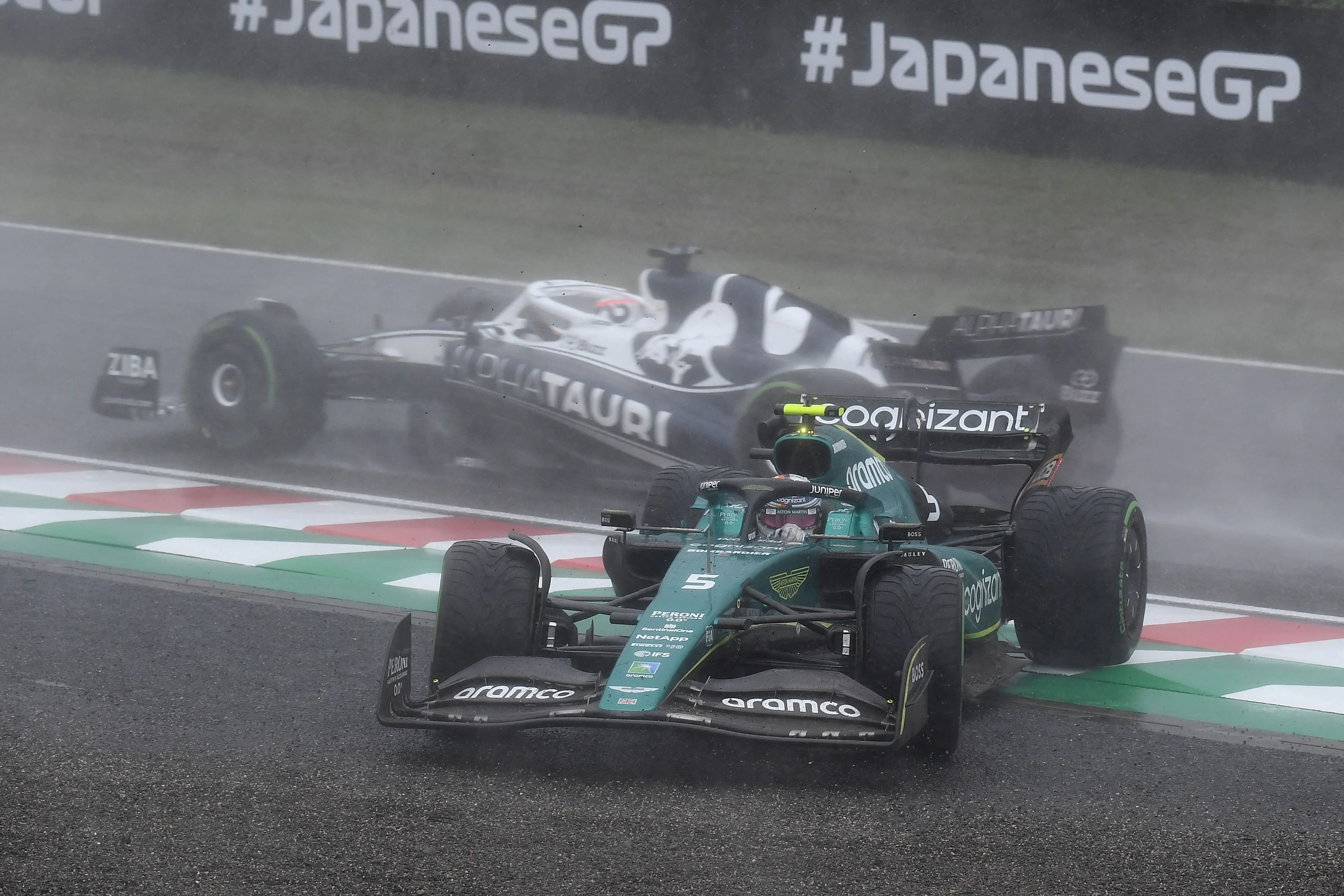 Aston Martin's German driver Sebastian Vettel (front) and AlphaTauri's French driver Pierre Gasly