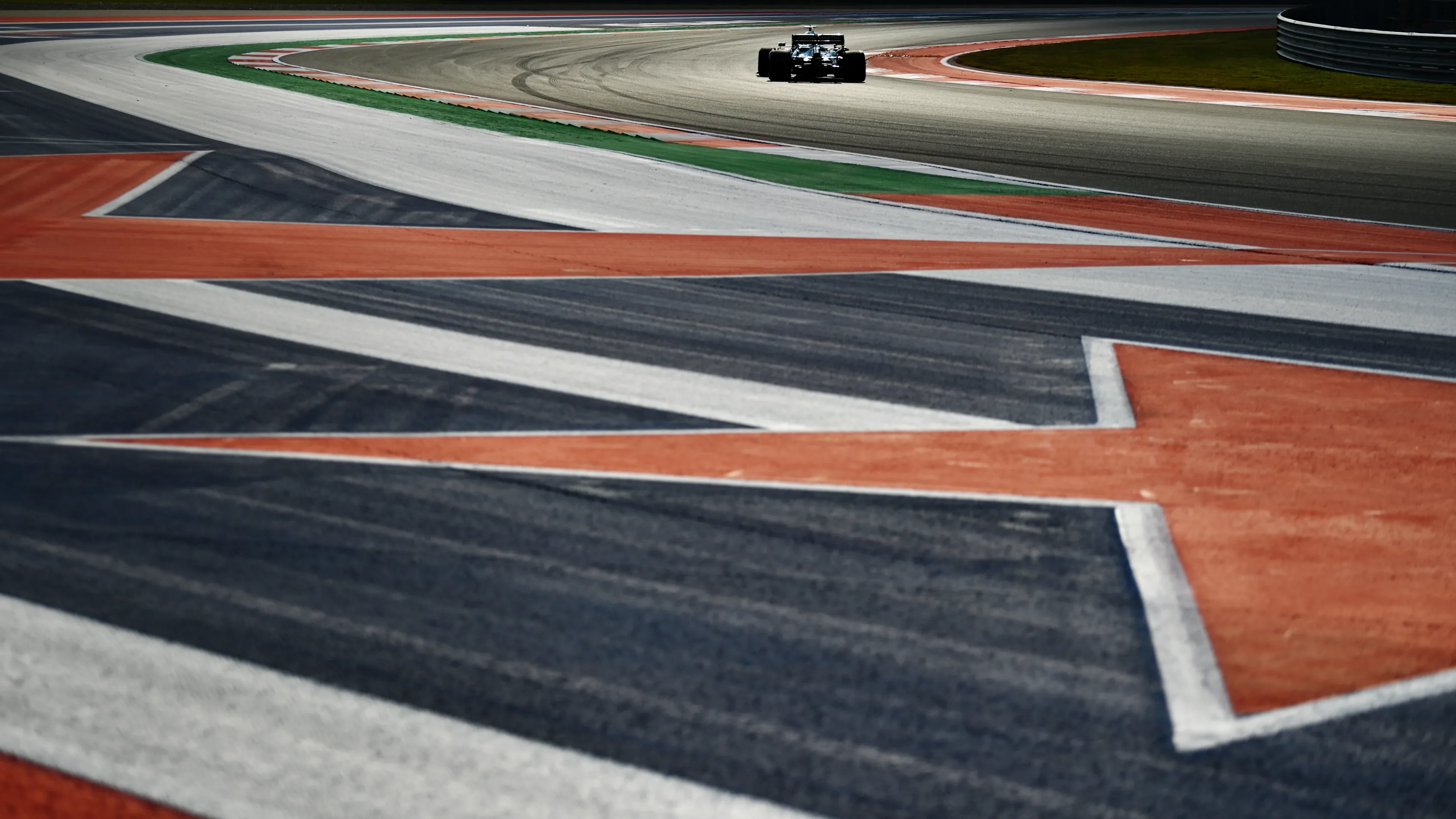 AUSTIN, TEXAS - OCTOBER 22: Lance Stroll of Canada driving the (18) Aston Martin AMR21 Mercedes