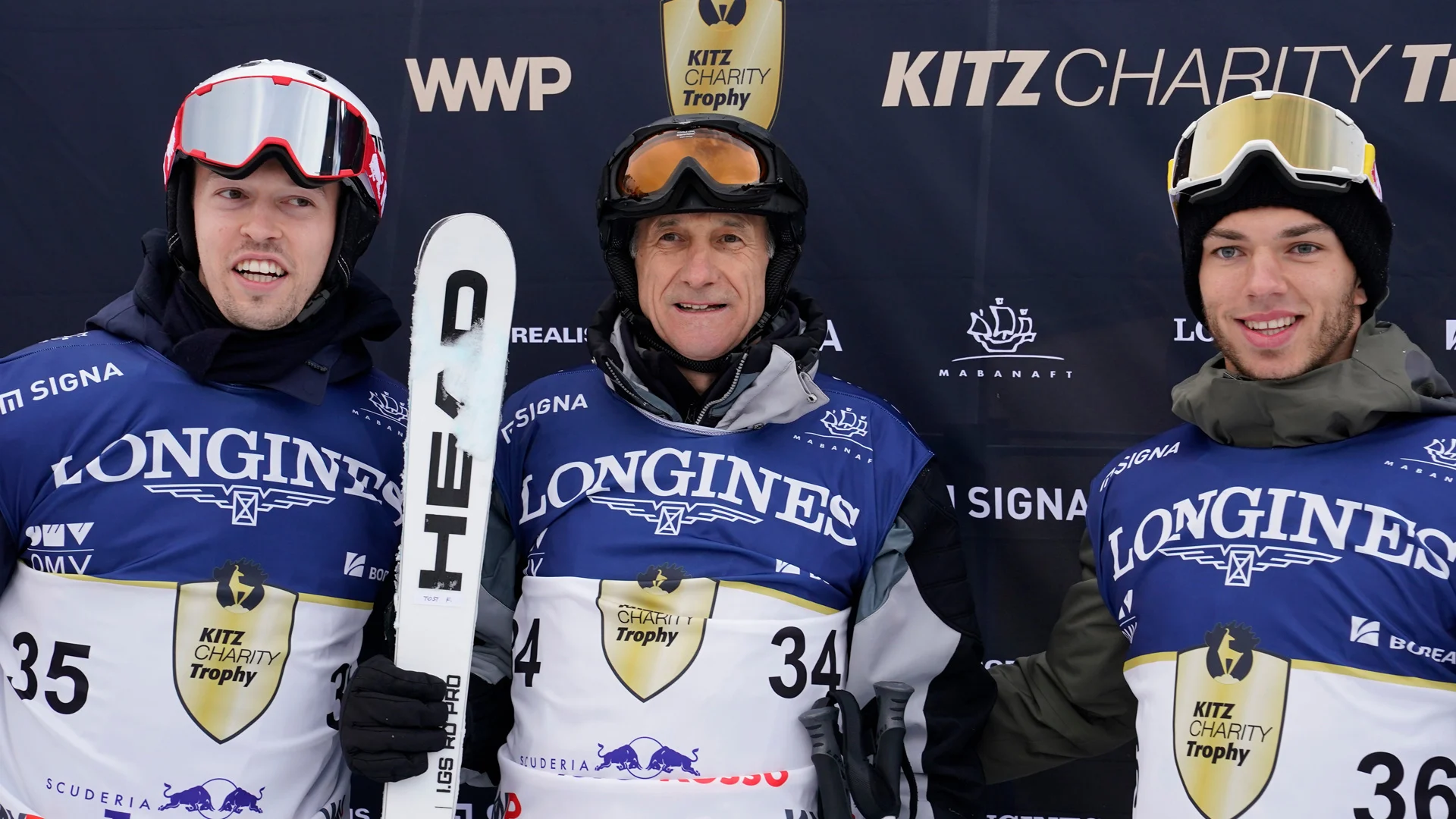 KITZBUEHEL, AUSTRIA - JANUARY 25: Danil Kvyat, Franz Toast and Pierre Gasly of Team Scuderia Toro