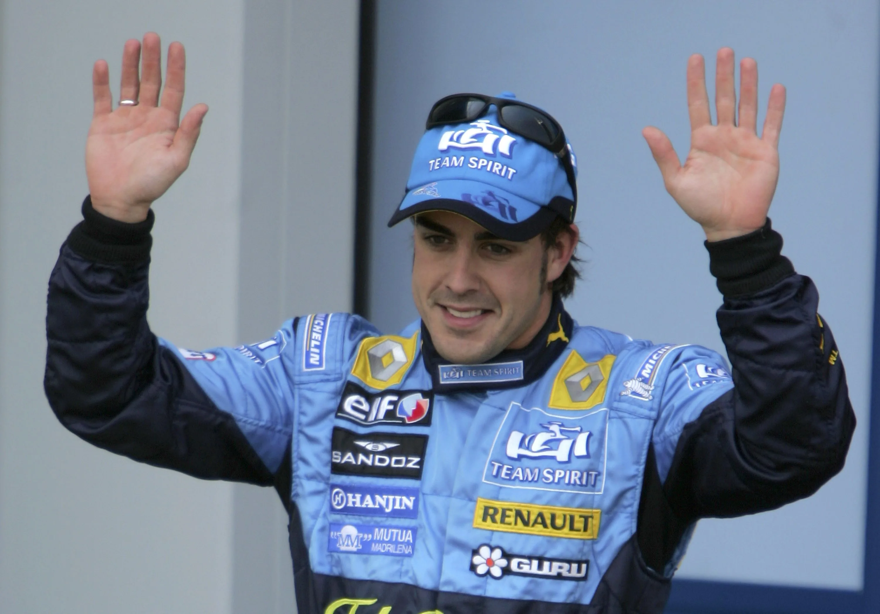 NURBURG, GERMANY - MAY 06: Fernando Alonso of Spain and Renault celebrates pole position during