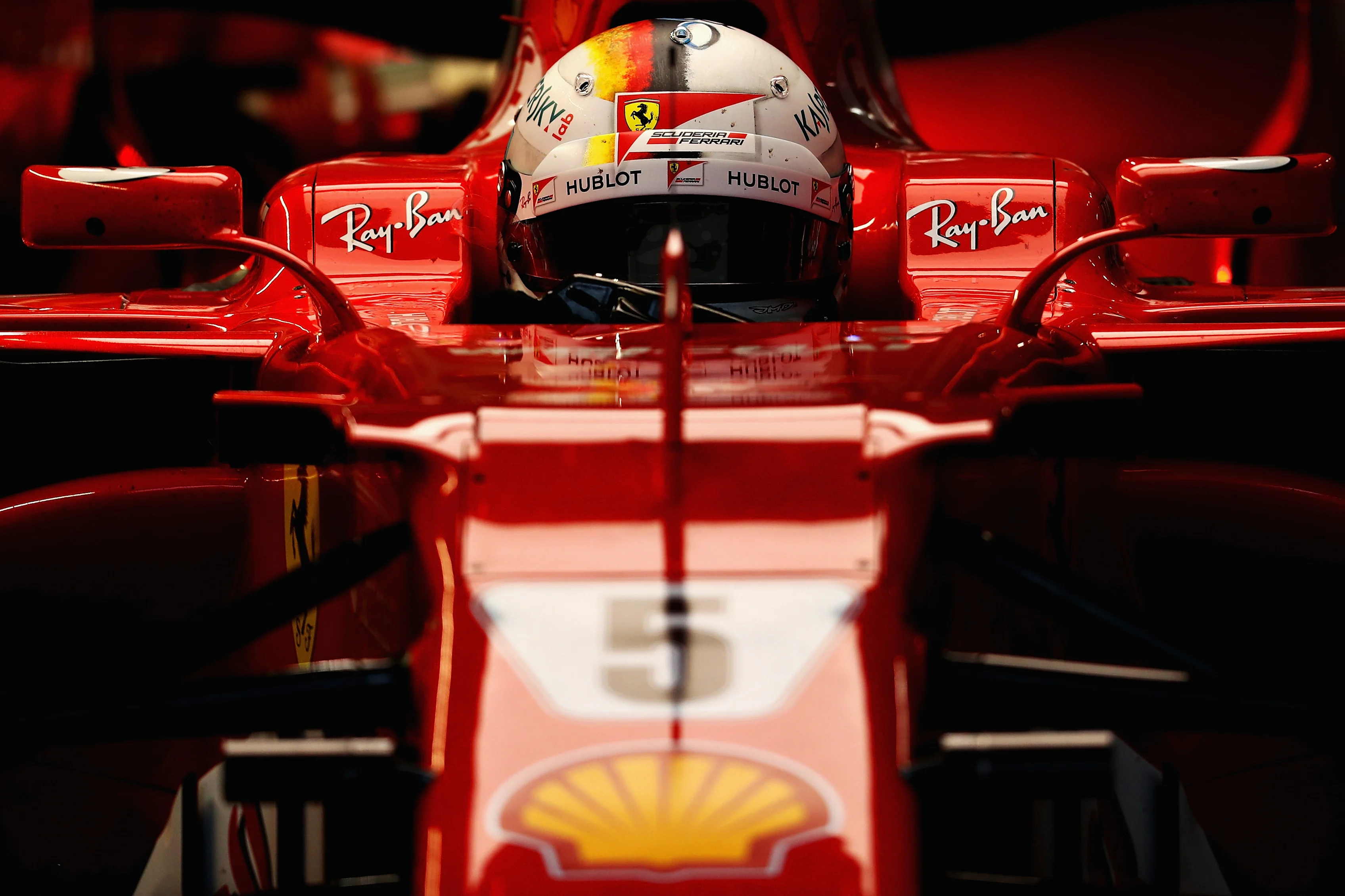 SUZUKA, JAPAN - OCTOBER 07: Sebastian Vettel of Germany and Ferrari prepares to drive in the