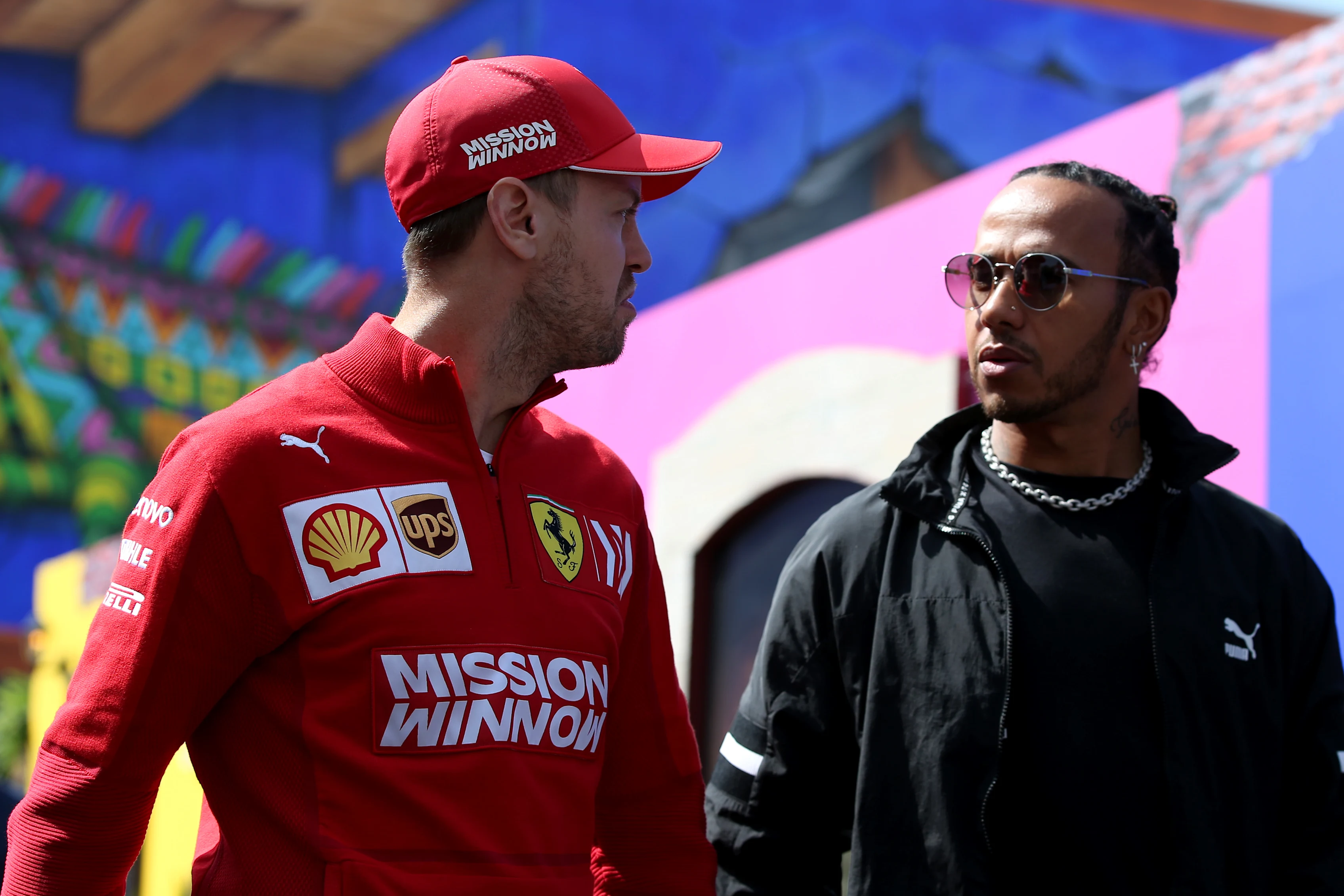 MEXICO CITY, MEXICO - OCTOBER 24: Sebastian Vettel of Germany and Ferrari and Lewis Hamilton of