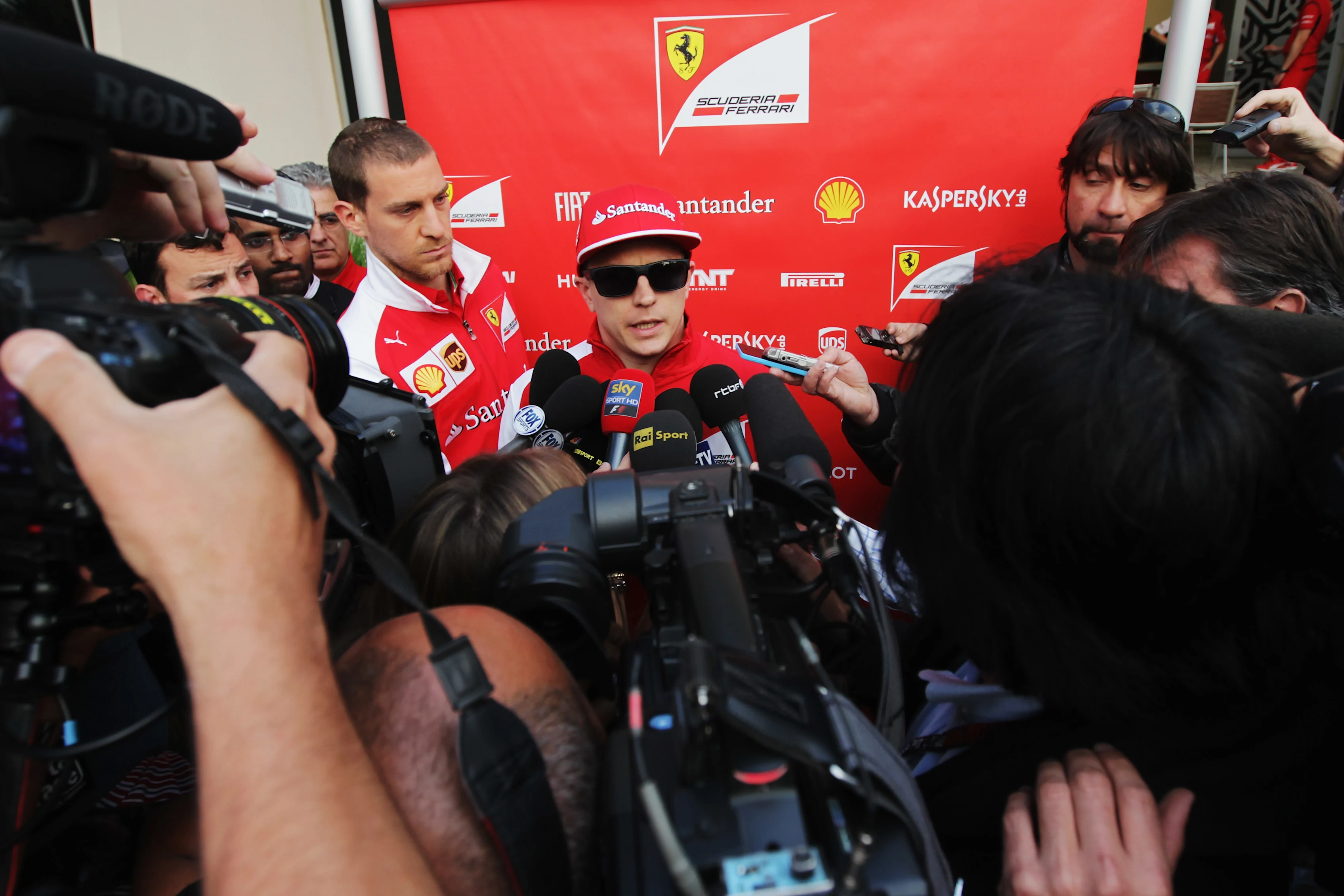 BAHRAIN, BAHRAIN - FEBRUARY 22: Kimi Raikkonen of Finland and Ferrari talks at the drivers