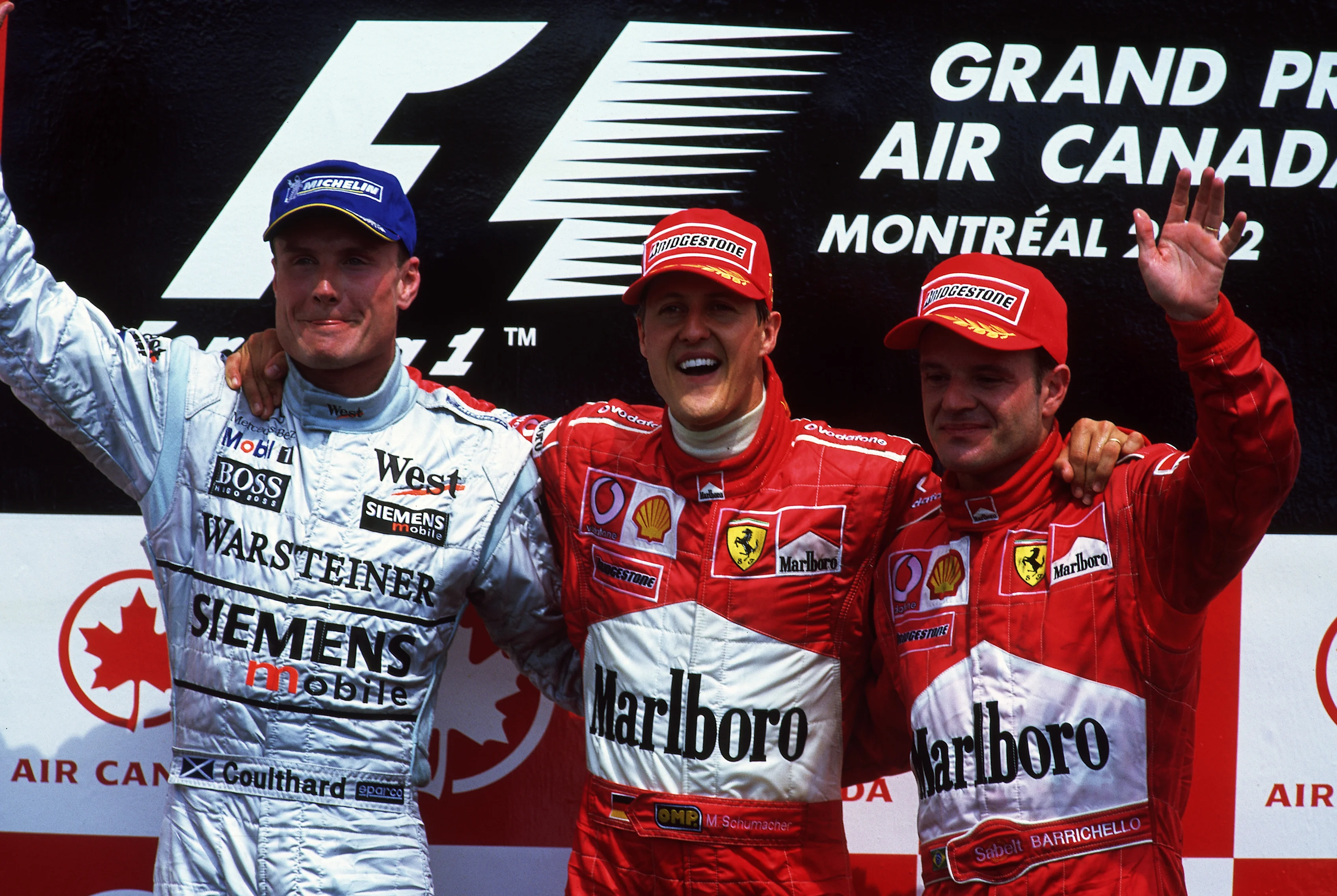 MONTREAL - JUNE 9: Ferrari driver Michael Schumacher (centre) of Germany celebrates his victory