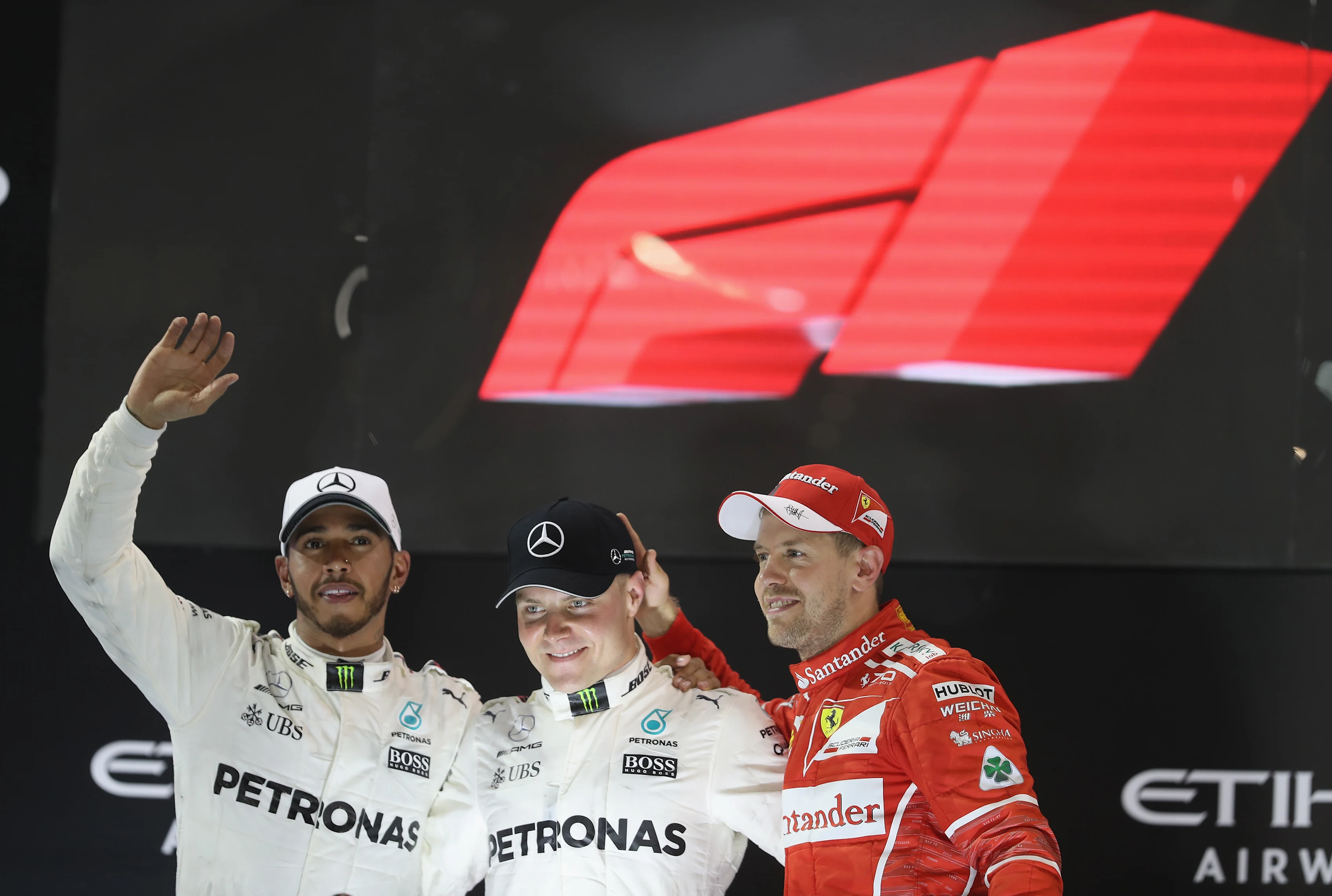 ABU DHABI, UNITED ARAB EMIRATES - NOVEMBER 26: Top three finishers Valtteri Bottas of Finland and