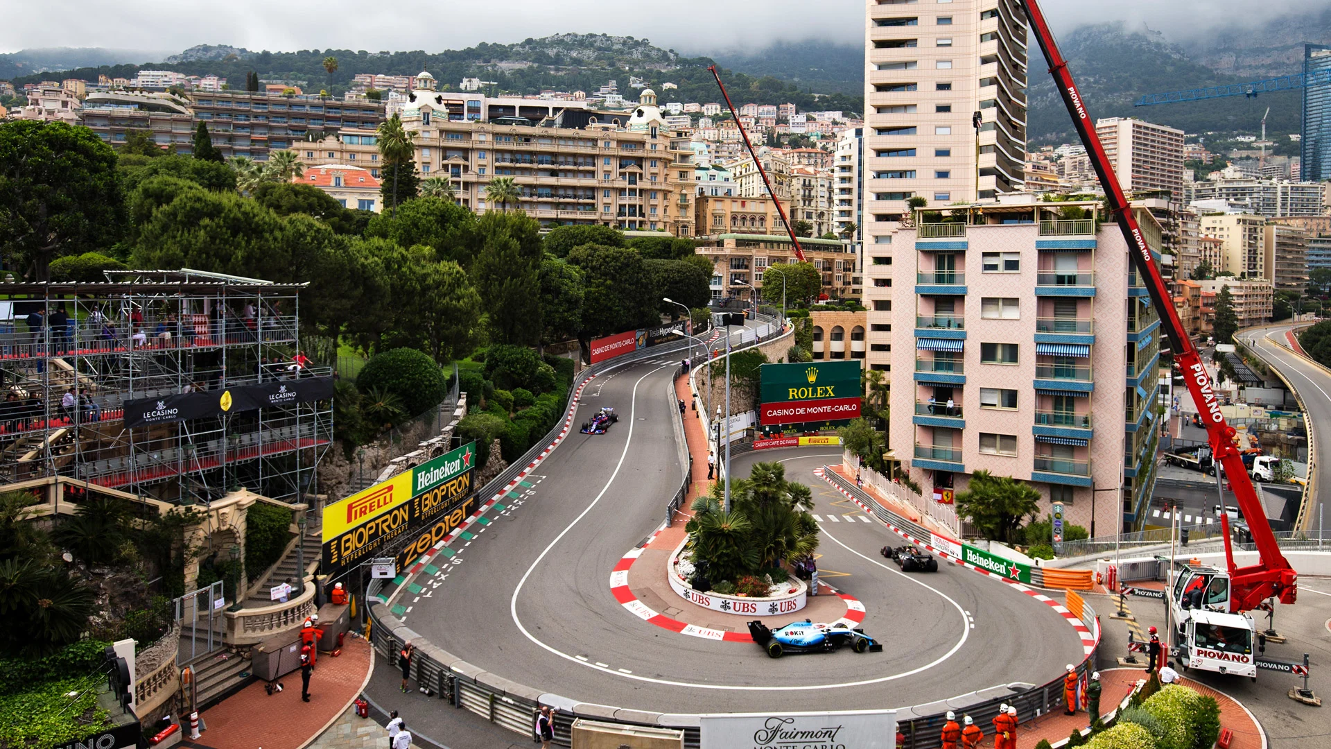 Kevin Magnussen (DEN) Haas VF-19 leads George Russell (GBR) Williams Racing FW42 and Daniel