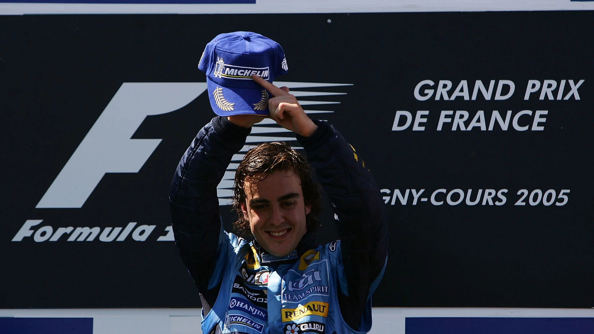 MAGNY COURS, FRANCE - JULY 03: Fernando Alonso of Spain and Renault celebrate after winning the