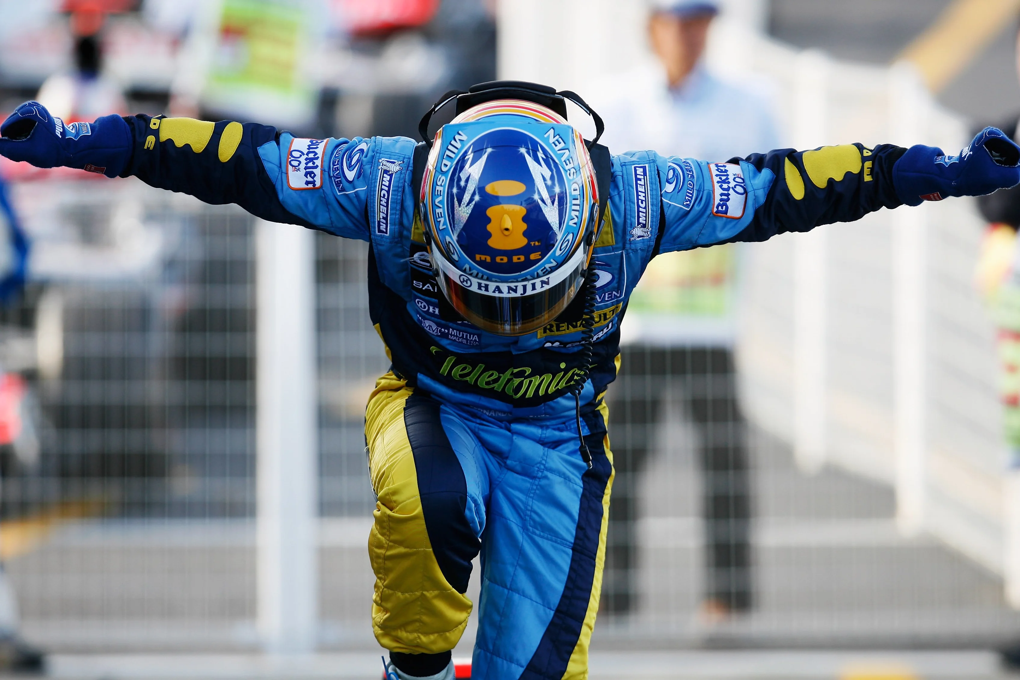 SUZUKA, JAPAN - OCTOBER 08: Fernando Alonso of Spain and Renault celebrates his victory during the