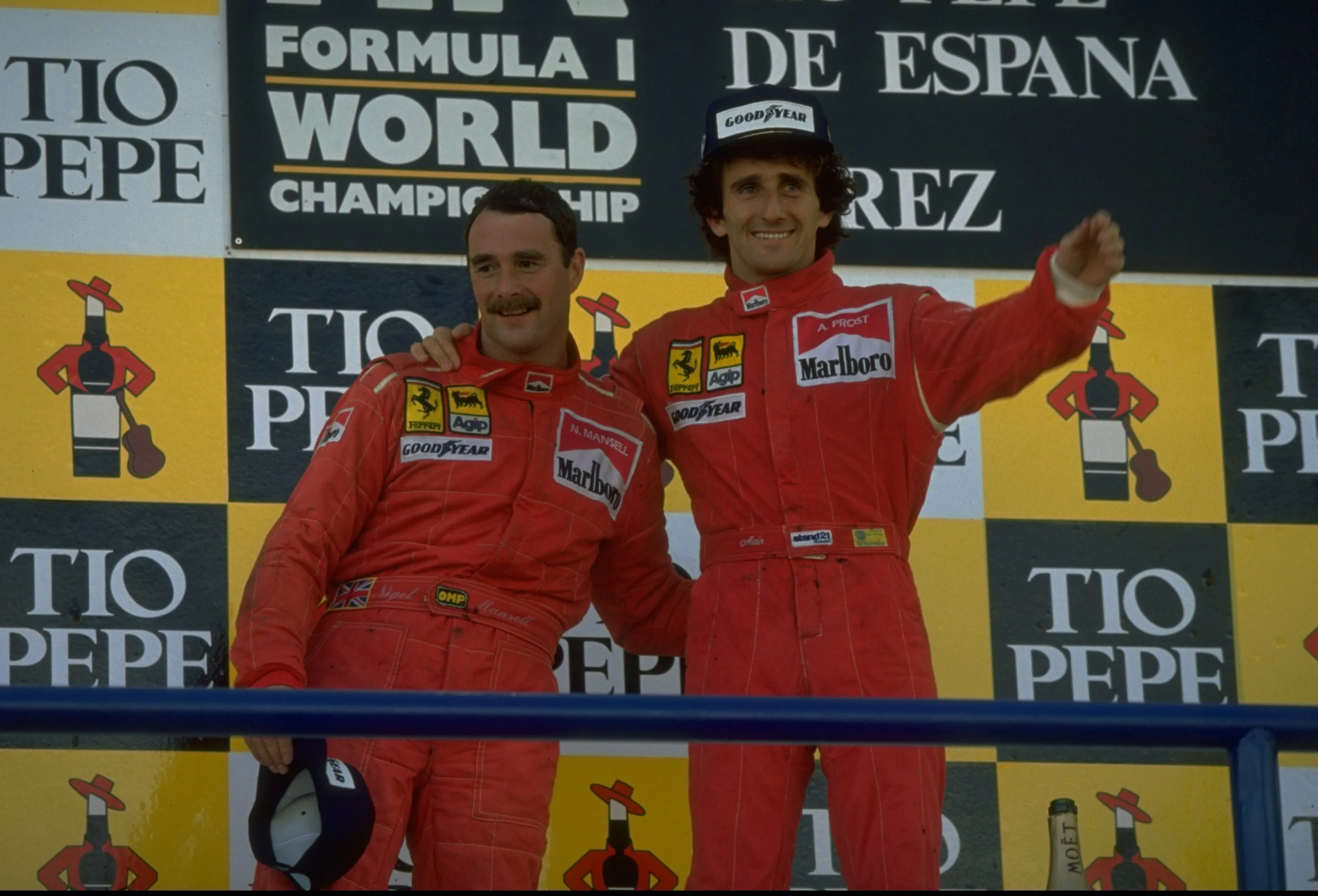 1990: Scuderia Ferrari drivers Nigel Mansell (left) of Great Britain and Alain Prost (right) of